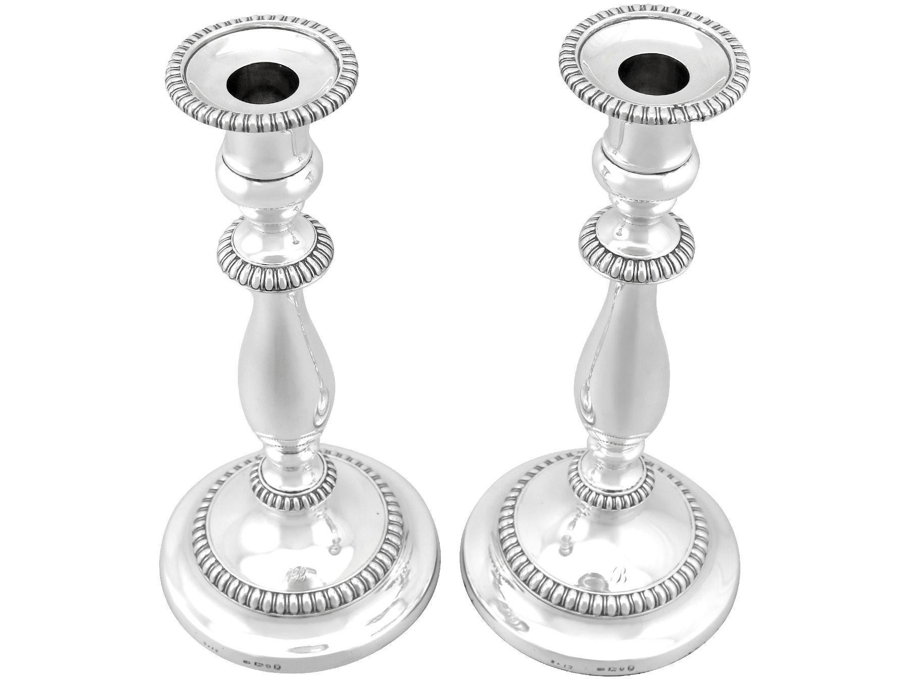 An exceptional, fine and impressive pair of antique George III English sterling silver candlesticks; part of our Georgian ornamental silverware collection

These exceptional antique George III English sterling silver candlesticks have a