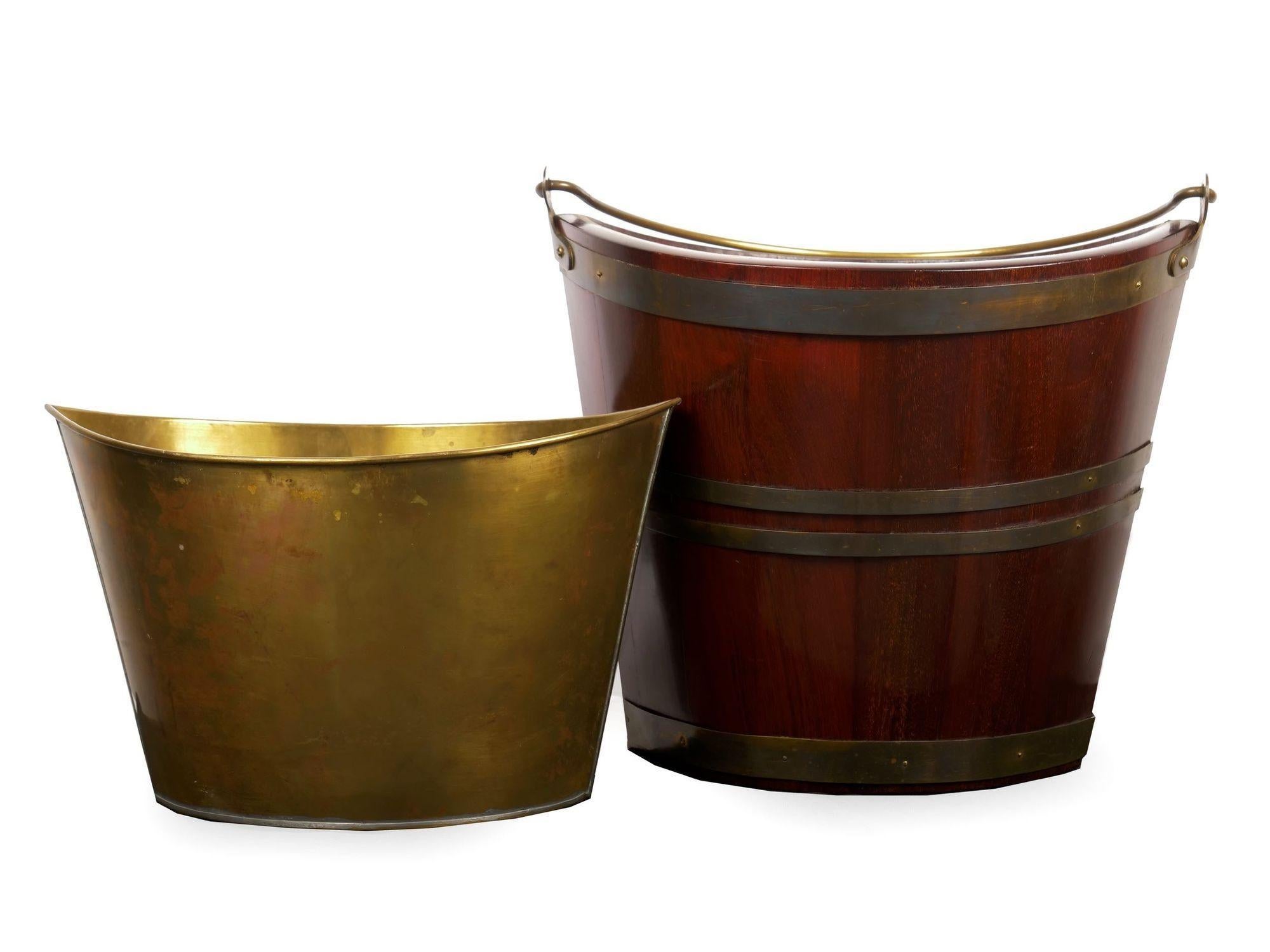 George III brass-bound mahogany peat bucket of navette form
With original brass bucket lining, circa early to mid-19th century
Item # C104012

This fine George III peat bucket is of navette form with a vertically staved tapering to the body