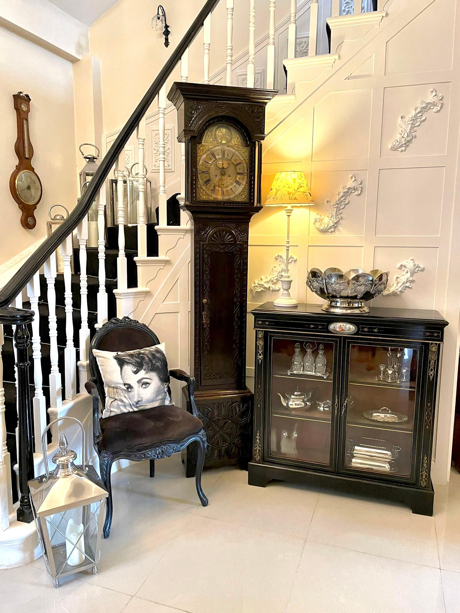 Antique George lll carved oak longcase clock having a quality attractive brass dial with original hands, engraved centre and date dial. It is signed by Henricus Baker of Appleby. It has an eight day movement striking on the hour and half hour on a