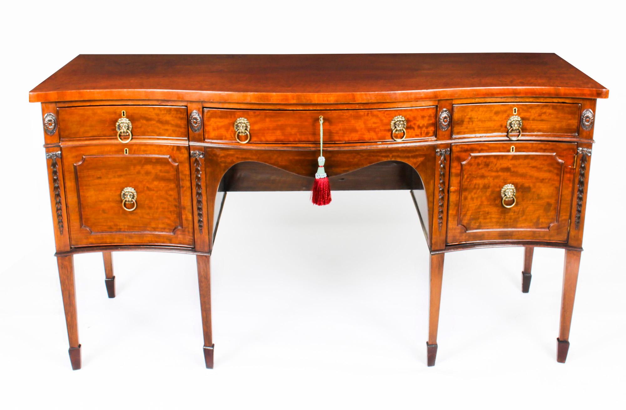 This is a superb antique George III inlaid flame mahogany serpentine sideboard, circa 1820 in date.
 
The sideboard features a shaped top with a central drawer and two right hand side frieze drawers with a double depth drawer on the left hand side.