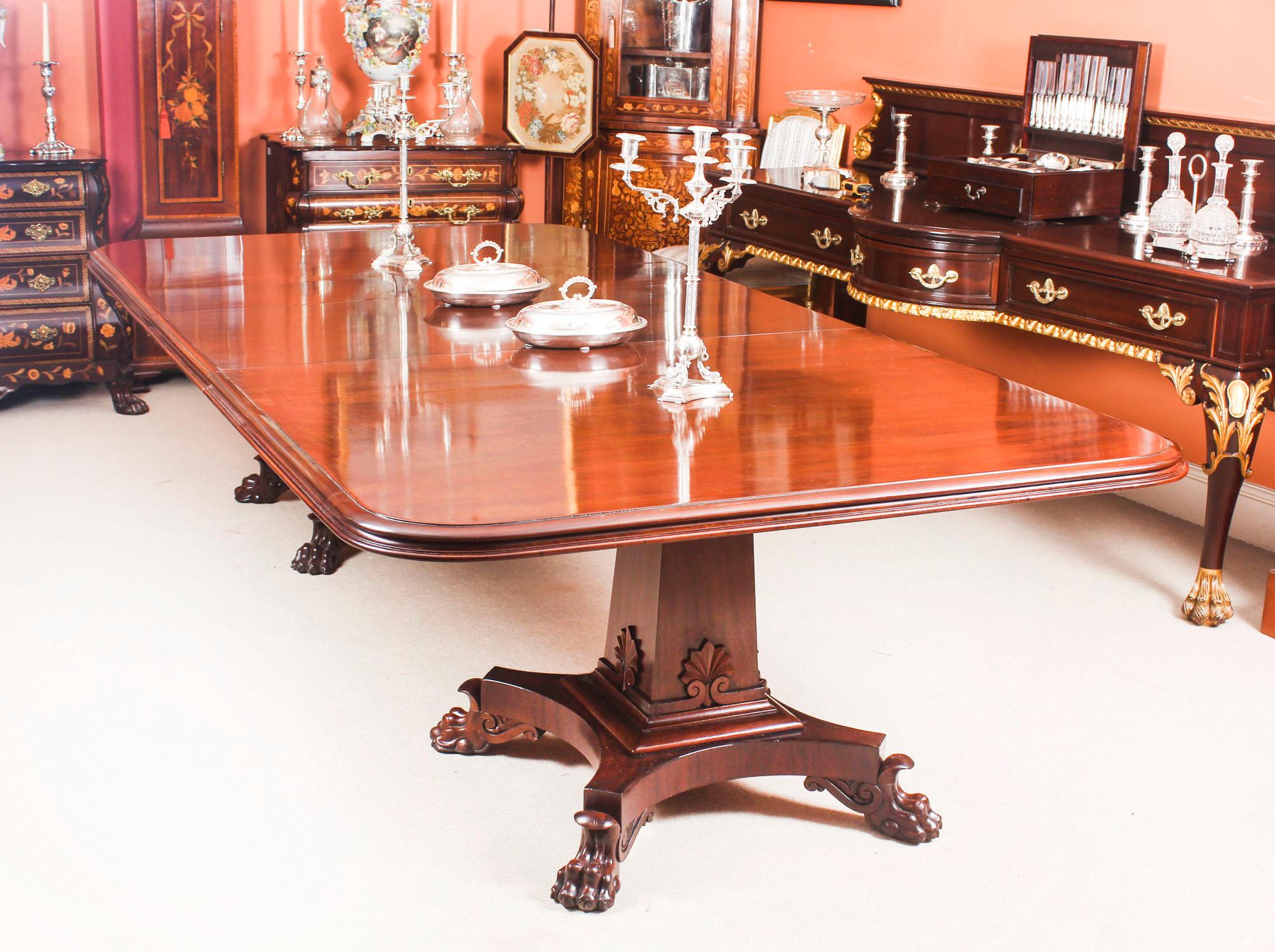 This is a beautiful antique George III flame mahogany btwin pedestal extending dining table, circa 1810 in date.

This amazing table can sit ten people in comfort and will stretch to 12 when two people are seated at each end. It has been