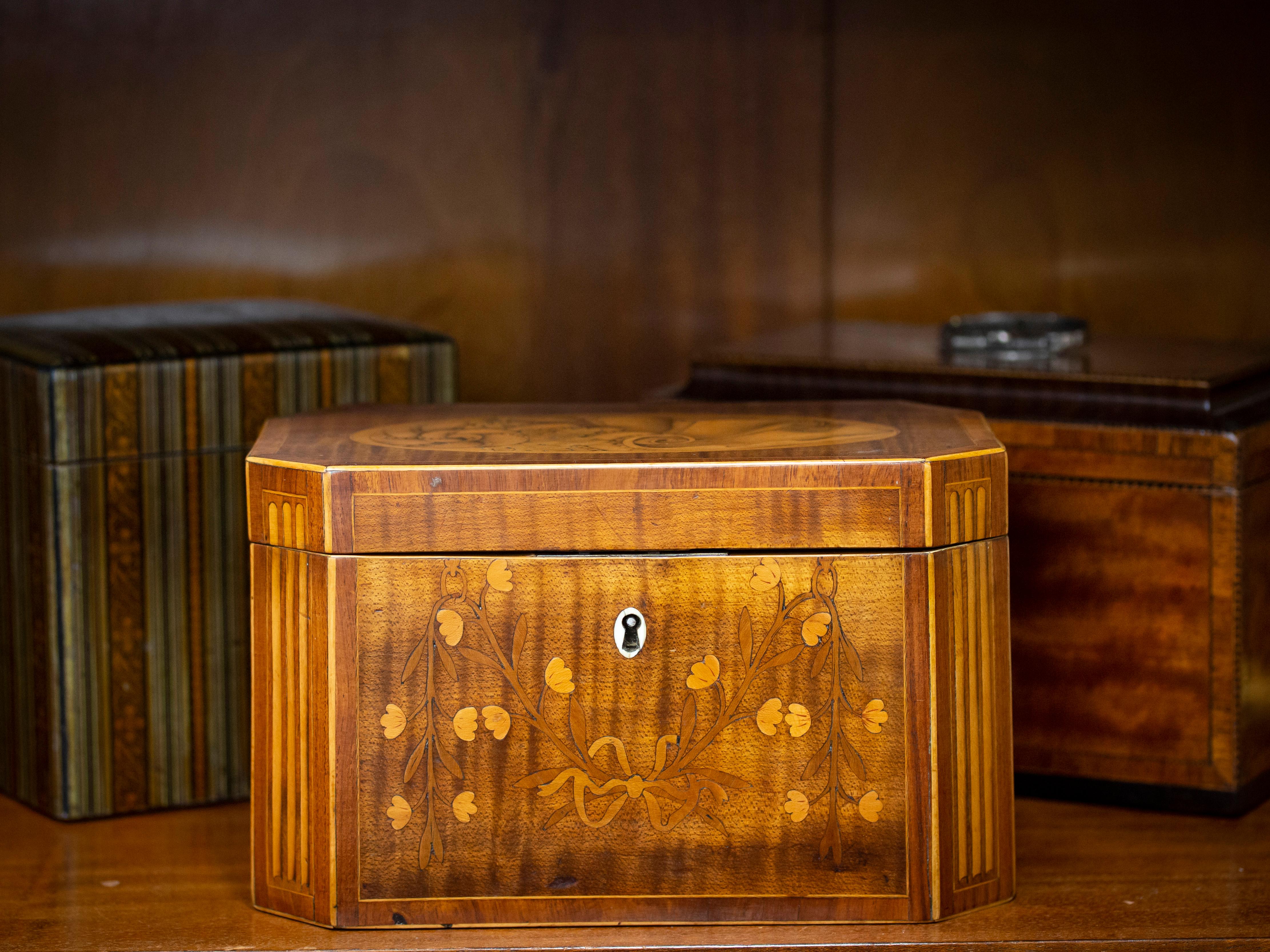 With Two Tea Caddies

From our Tea Caddy collection, we are pleased to offer this Georgian Harewood Tea Chest. The Tea Chest of rectangular form veneered in Harewood with inlaid Boxwood fluted cants, quadrant boxwood edging and Tulipwood crossbanded