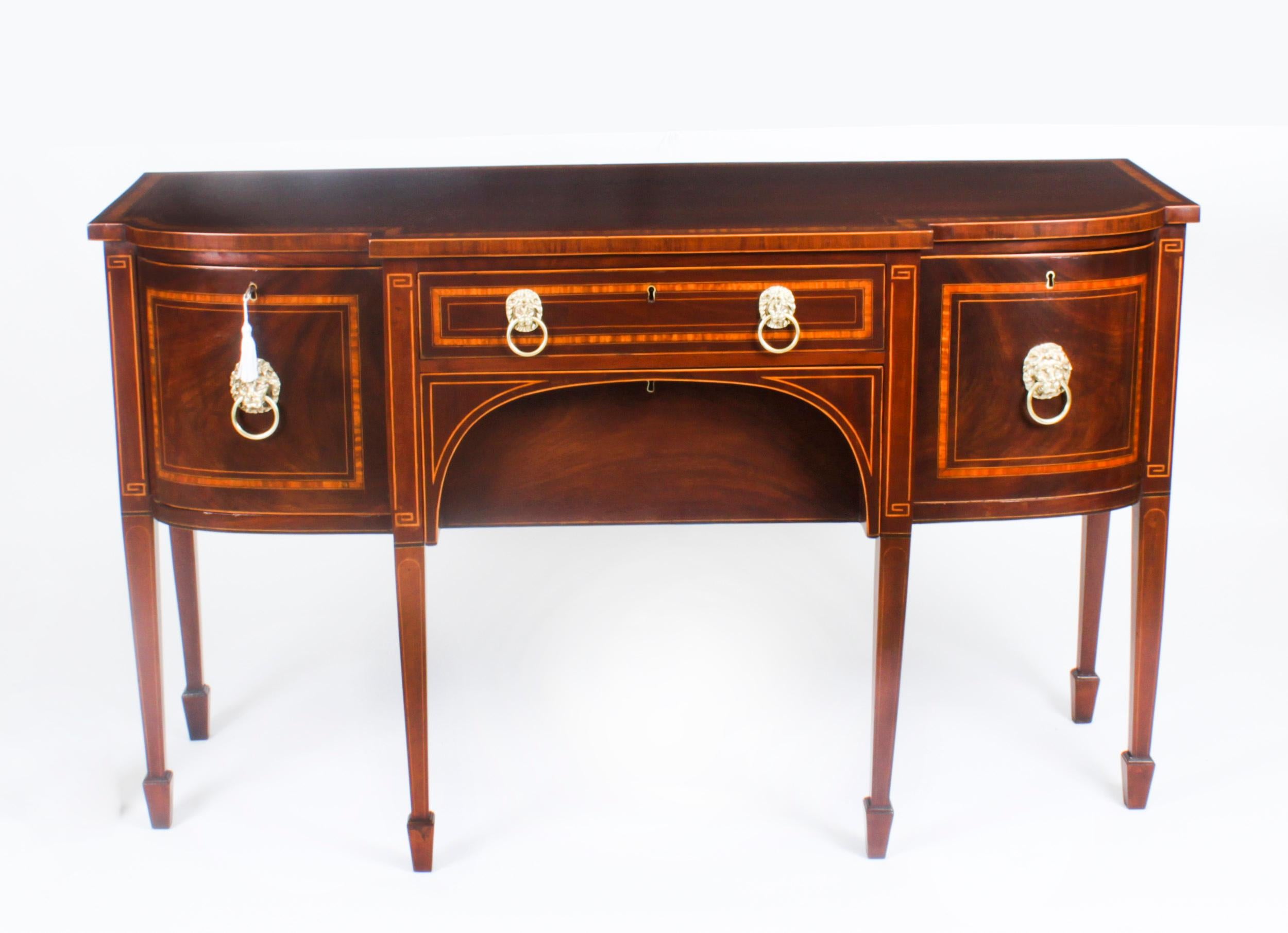 This is a superb antique George III inlaid flame mahogany and crossbanded bowfront sideboard, circa 1780 in date.
 
The sideboard is cross banded in satinwood with boxwood inlay and has a central frieze drawer above a deep drawer. There is a shaped