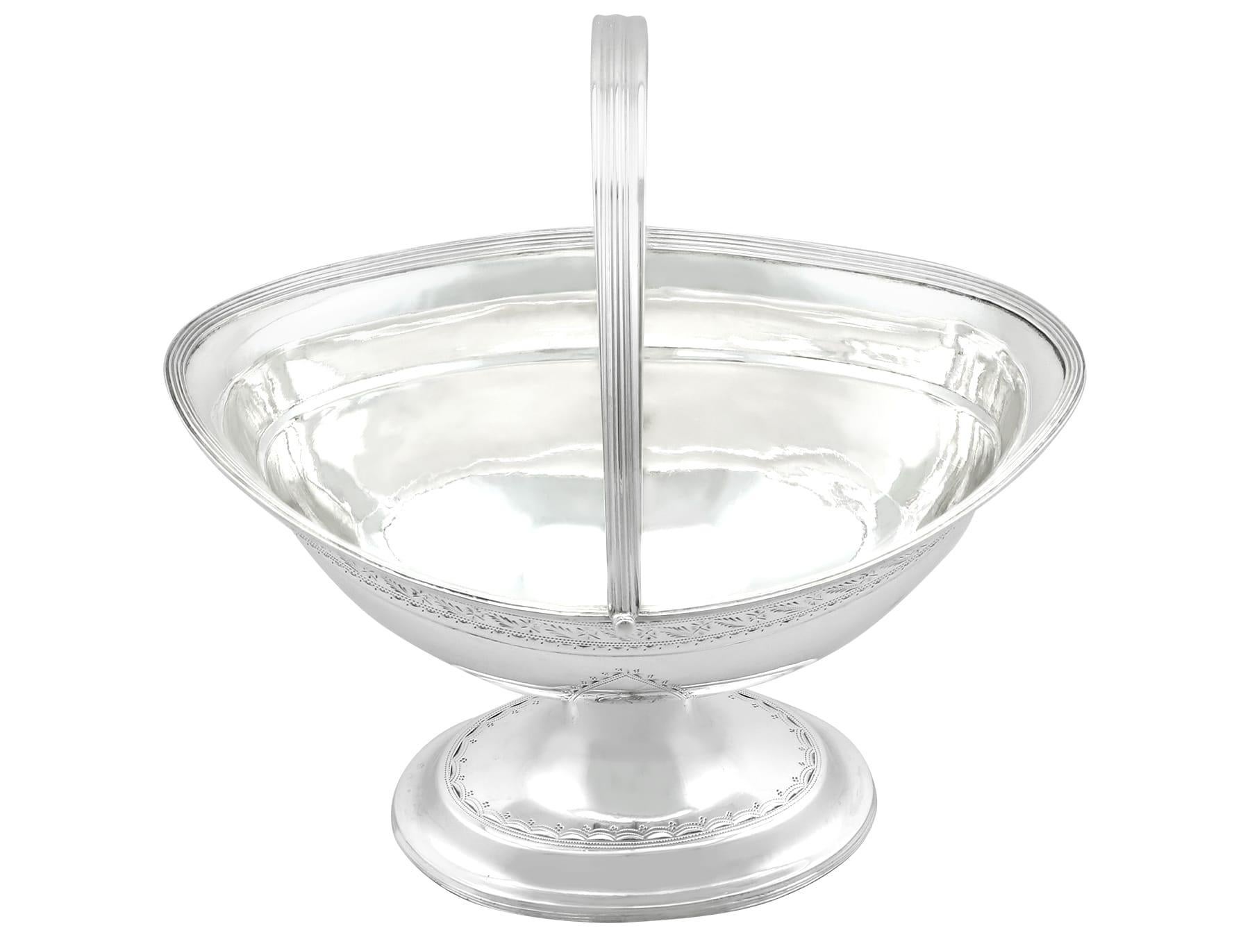 An exceptional, fine and impressive antique George III Irish sterling silver sugar basket; an addition to our Georgian silverware collection.

This exceptional antique George III Irish sterling silver sugar/bon bon basket has a plain oval rounded