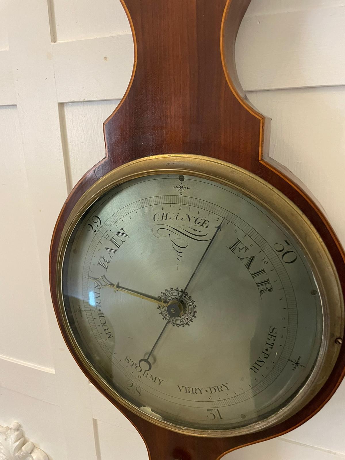 Antique George III mahogany and boxwood inlaid banjo barometer having a quality swan neck pediment, 10 inch silvered engraved dial with hygrometer, thermometer and spirit level, original brass bezel and hands. Signed C Marinone.

In lovely