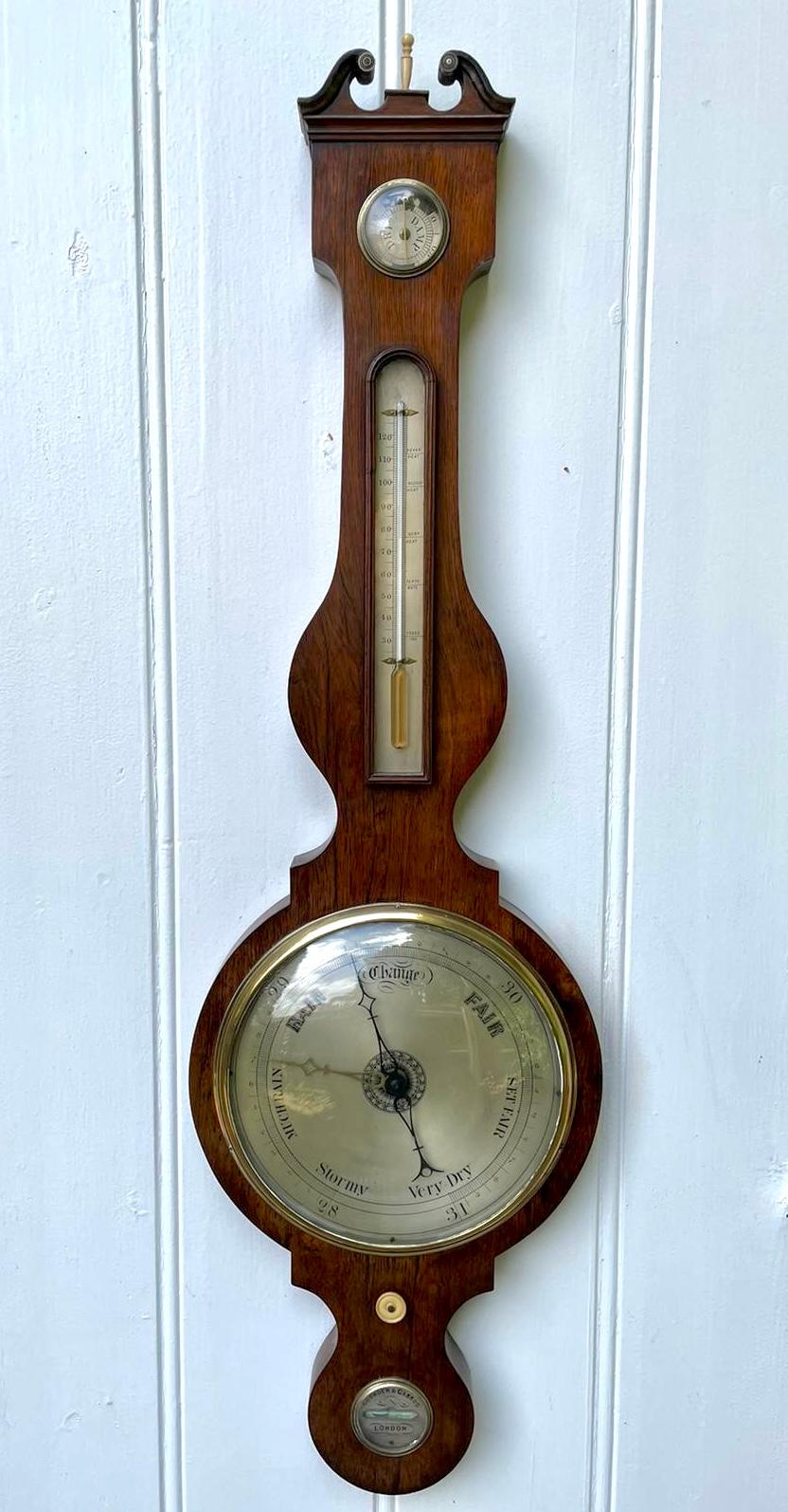 Antique George III mahogany banjo barometer having a quality mahogany case with a swan neck pedometer and the original turned bone finale, 9 inch silvered dial with original hands with a thermometer, hygrometer, spirit level and the original bone