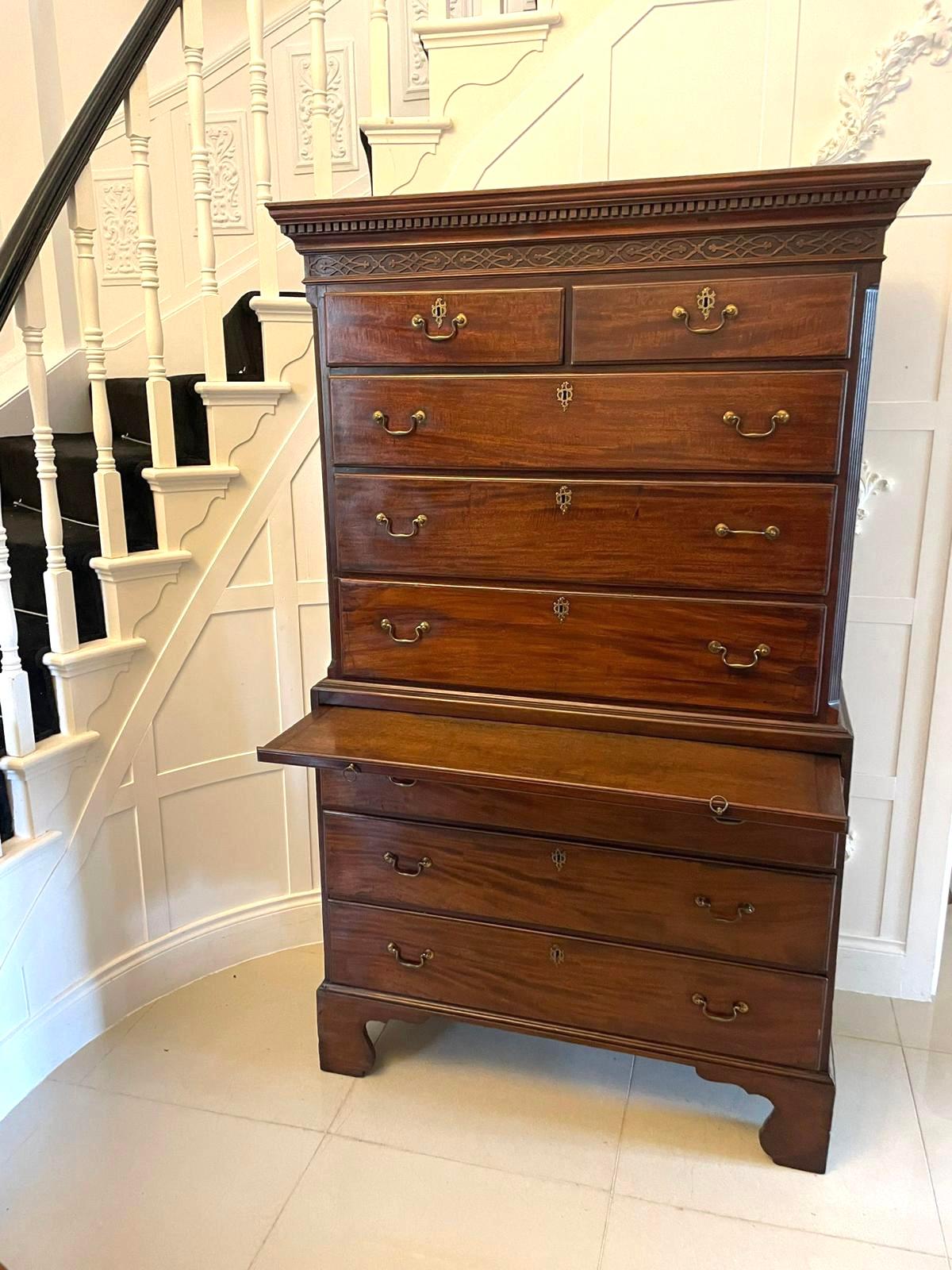 George III mahogany chest on chest with the upper section having a dentil cornice and two short over three long drawers with original brass handles. The base having a brushing slide and three long graduated drawers with original brass handles. It is