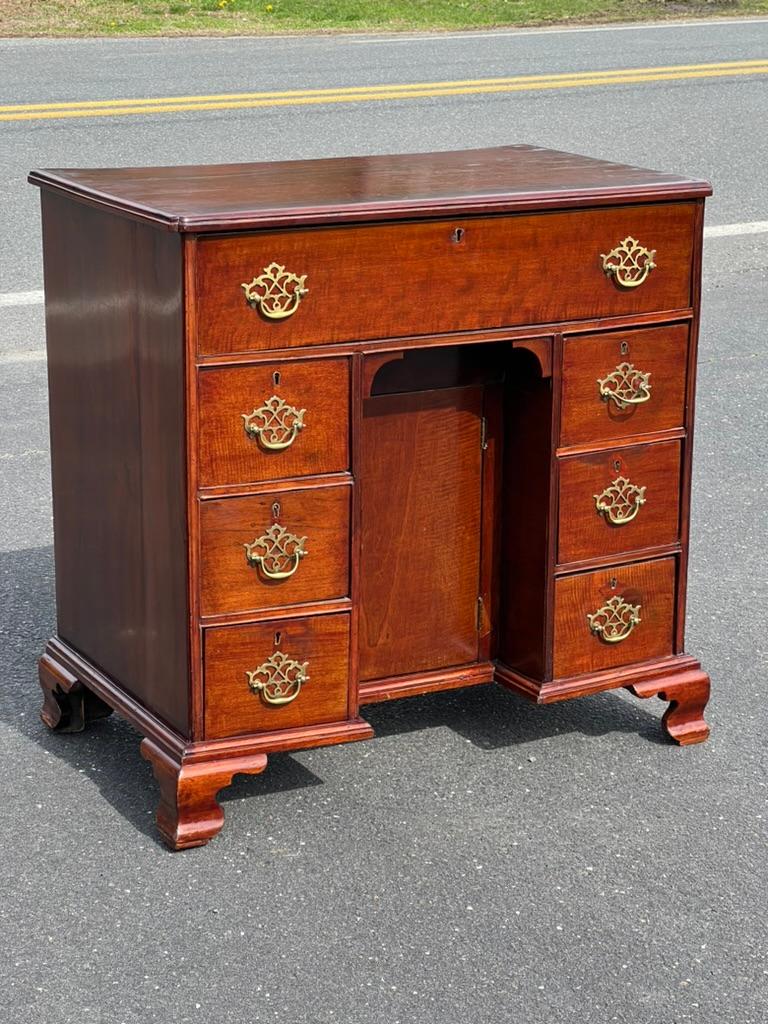 Step into the refined world of the late 18th century with our Antique George III Mahogany Kneehole Desk, a timeless piece that exemplifies the elegance and craftsmanship of the Georgian era.

Crafted from exquisite mahogany wood, this kneehole desk