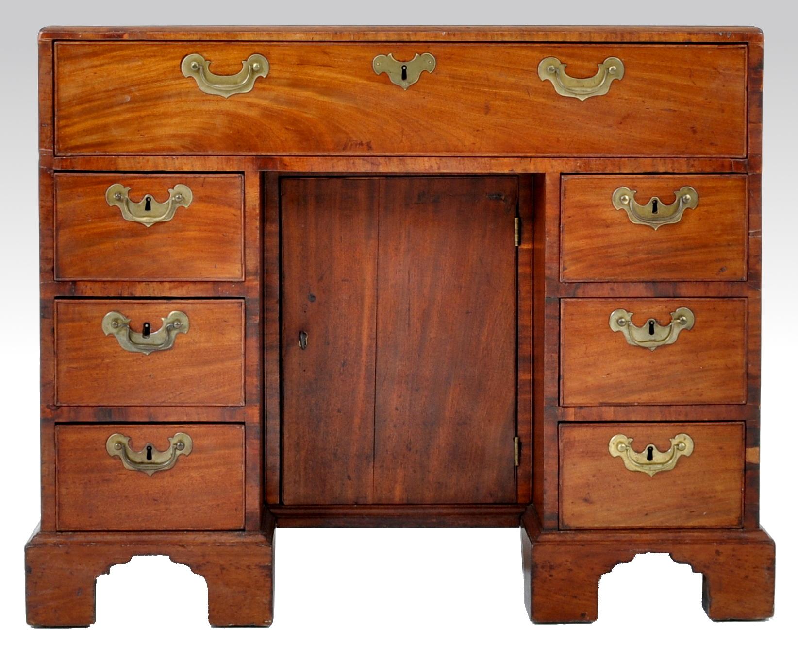 Antique George III mahogany kneehole secretary desk, circa 1780. The desk having one long drawer to the top over twin pedestals, each housing three drawers, the desk having a recessed cupboard enclosing a single shelf. The desk raised on bracket