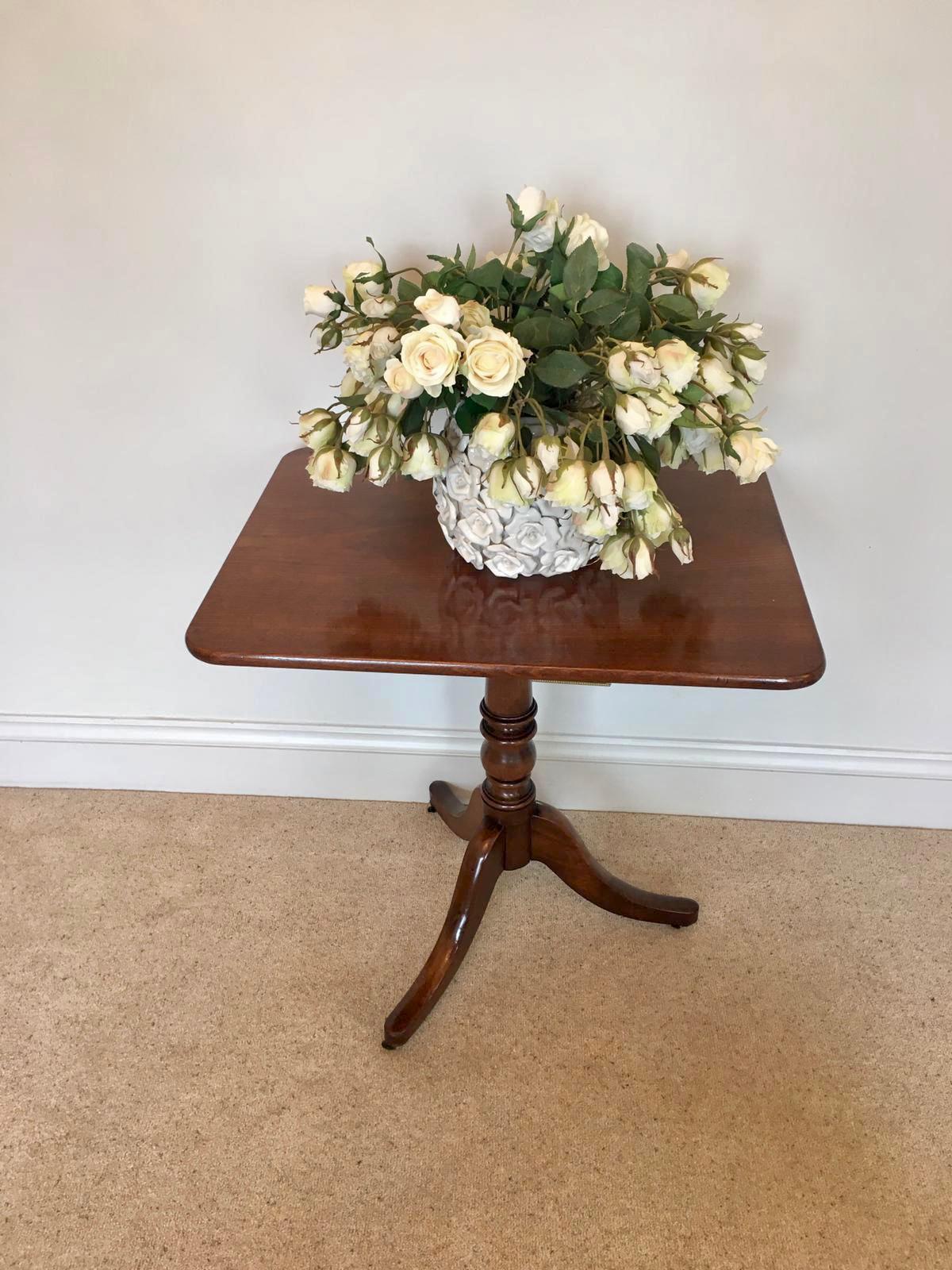 Antique George III mahogany table having a rectangular mahogany top supported by an elegant shaped turned column standing on three mahogany shaped sabre legs.

A lovely example in original condition having a desirable colour and