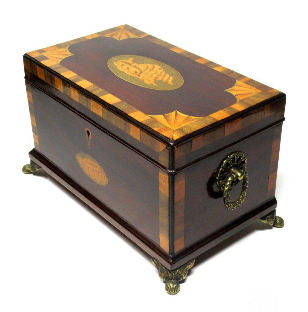 Impressive English George III Sheraton period flame grain mahogany triple tea caddy of outstanding quality and workmanship and generous size, circa 1800-1820.

The hinged lid crossbanded in rosewood and satinwood, fabulously inlaid with a large