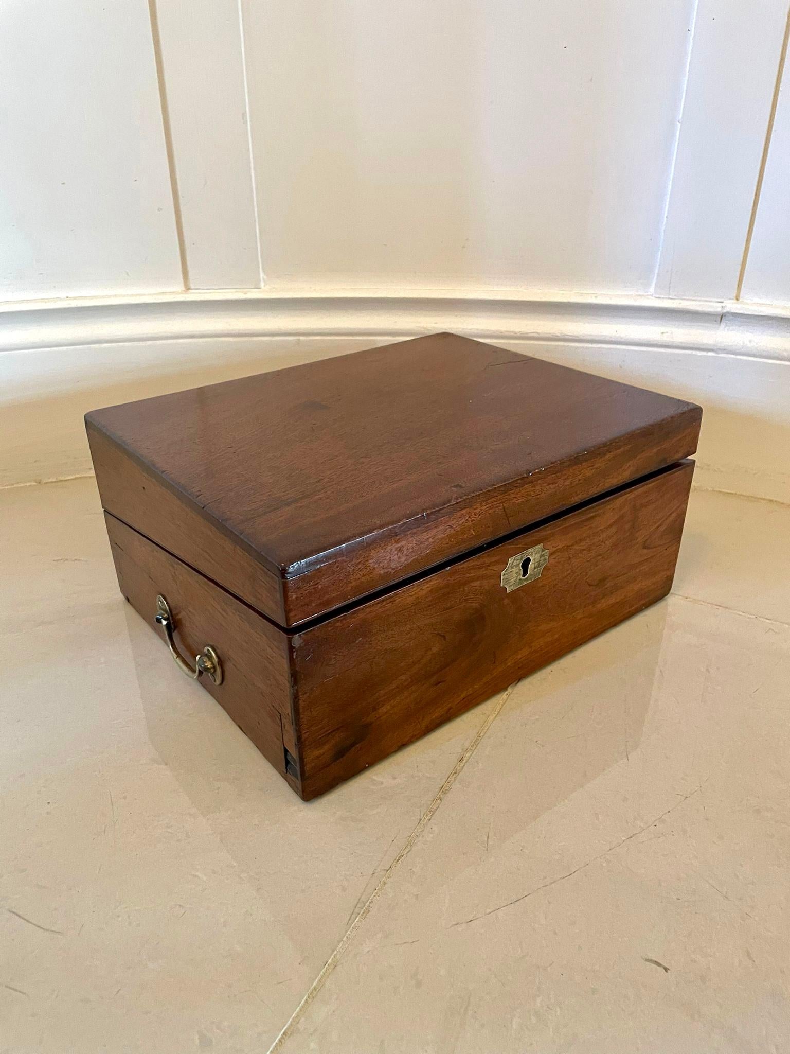 Quality antique George III mahogany wriing box having a drawer to the side with original brass handles, lift up top opening to reveal a leather writing surface and two storage compartments and original pen tray. 

In lovely original