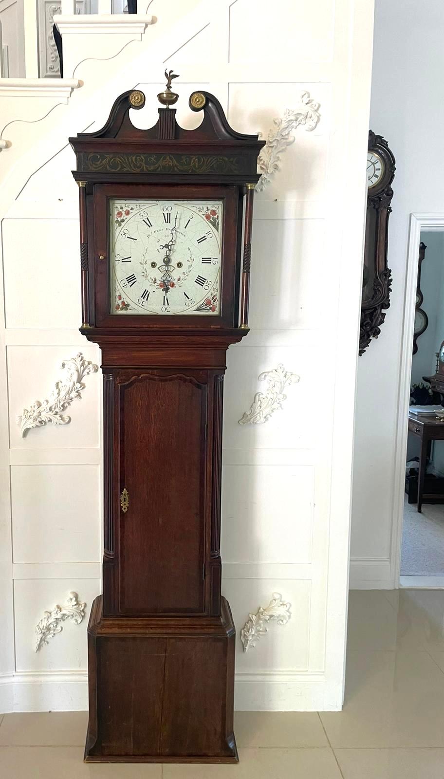 Antique George III oak eight day longcase clock having a well proportioned oak longcase with a painted enamel dial depicting pretty roses in bloom, elegantly designed hands, an 8 day duration striking on the hours on a bell. The case has good detail