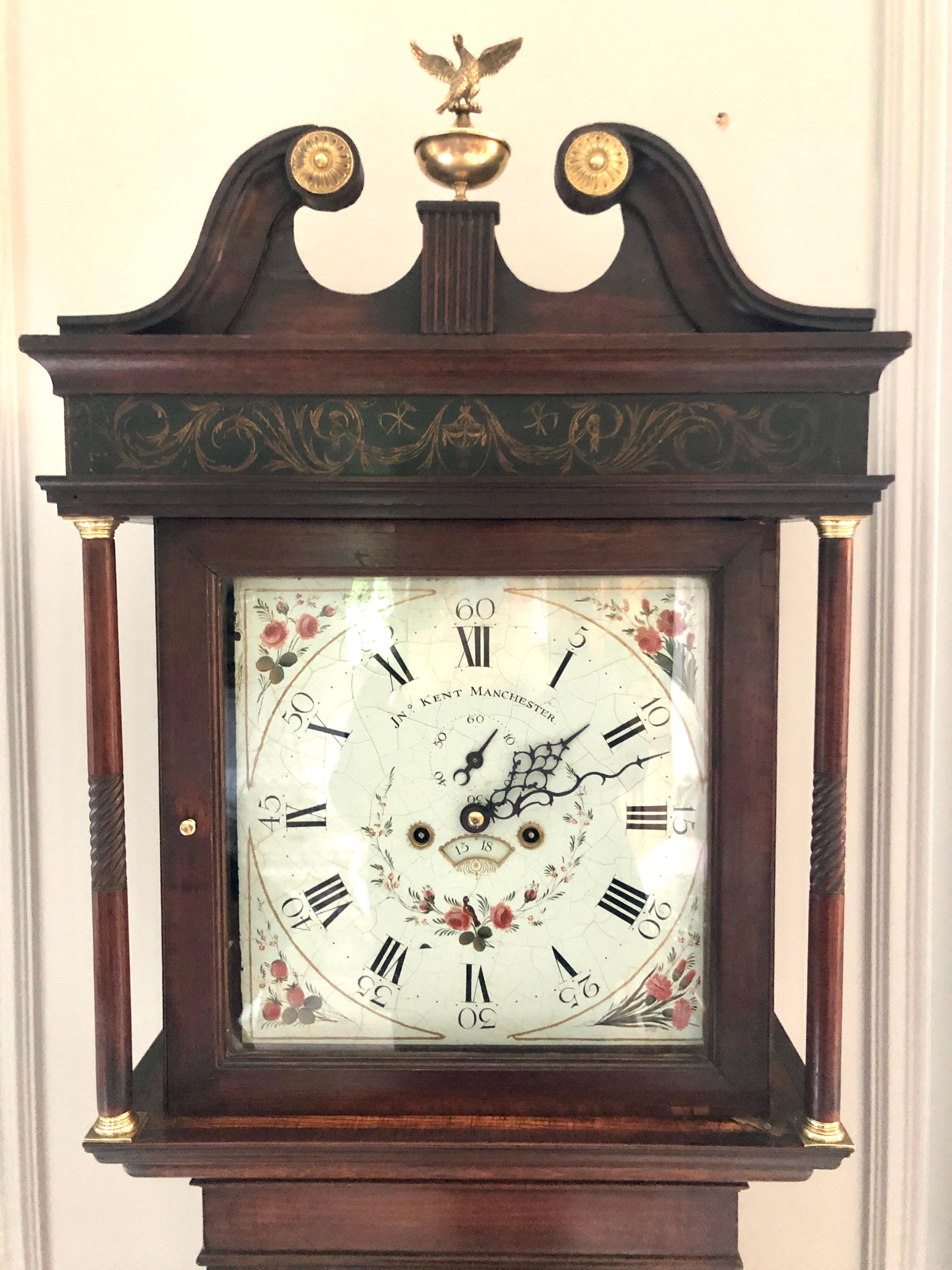 Antique George III oak eight day longcase clock having a well proportioned oak longcase with a painted enamel dial depicting pretty roses in bloom, elegantly designed hands, an 8 day duration striking the hours on a bell. The case has good detail