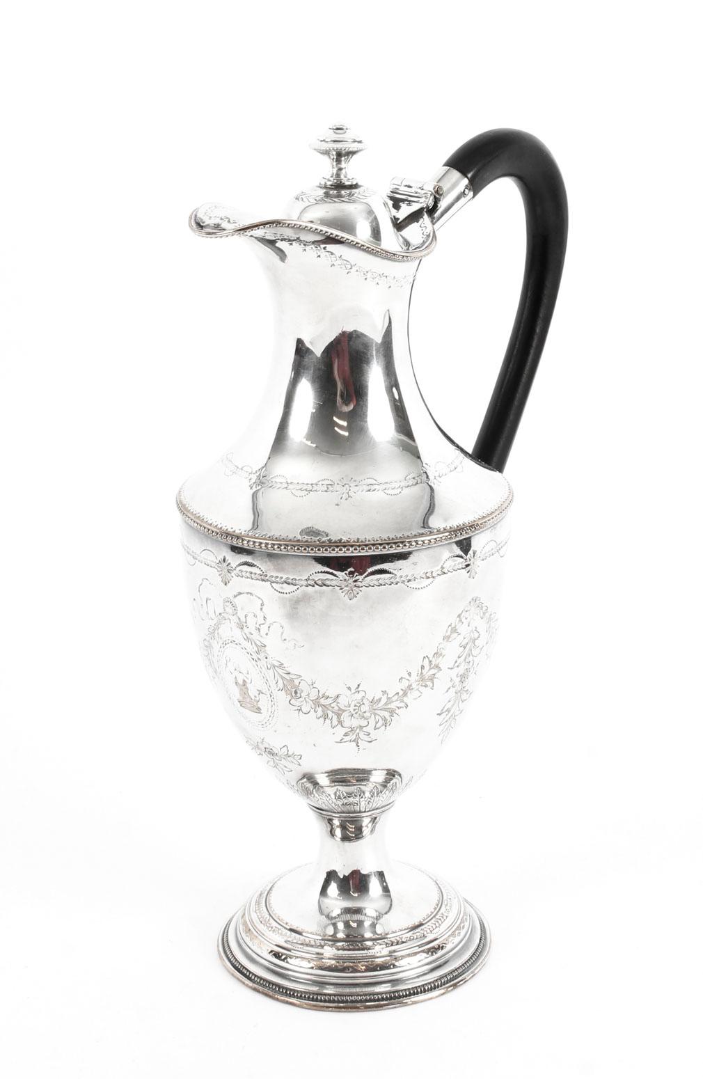 This is a fabulous antique Old Sheffield plate 18th century silver on copper claret jug, circa 1780 in date.

The claret jug is of baluster form and has an attractive circular foot. It is profusely engraved with shapes including ribbons, bows and
