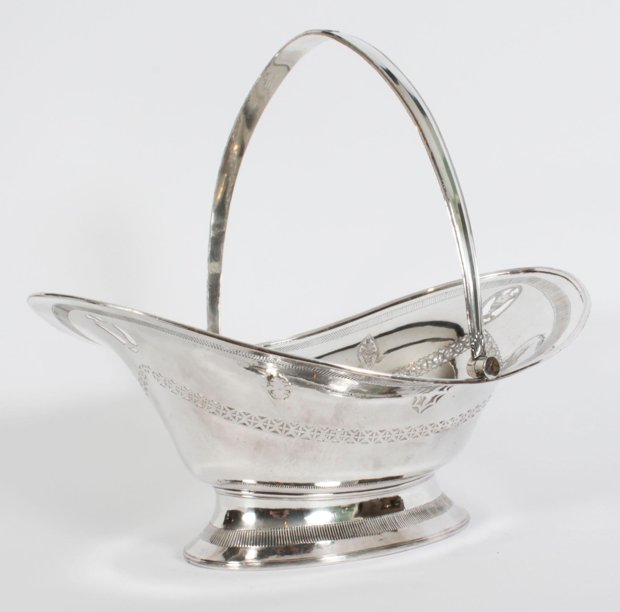 This is a fabulous antique Neo-classical George III Old Sheffield plate silver on copper bread basket / fruit dish, circa 1780 in date.
 
The oval swing handled dish features a pierced and engraved body in the Neo-Classical taste with a band of