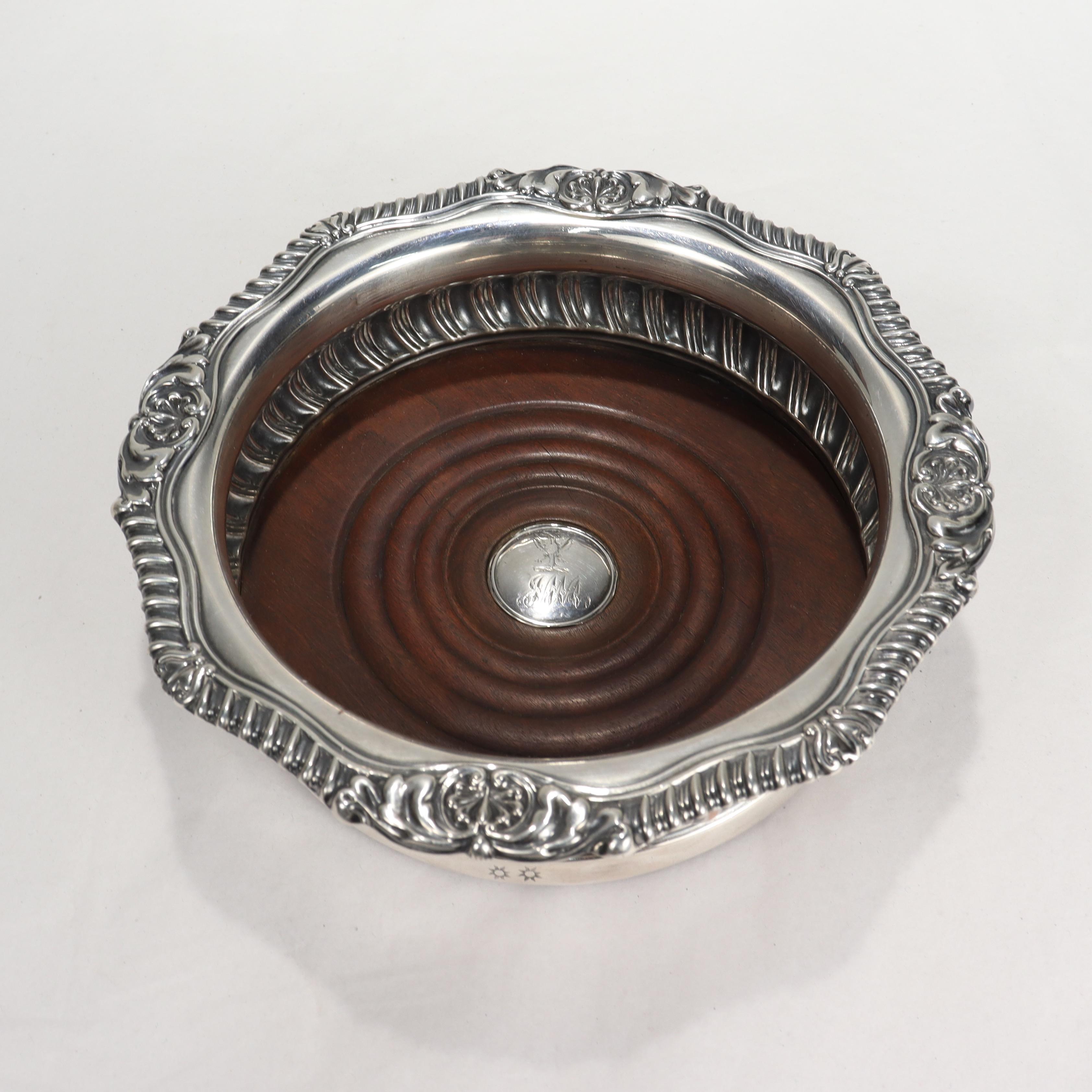 A fine antique Georgian English silver plated wine coaster.

By Matthew Boulton. 

The insert in the middle is decorated with a two-headed bird and monogrammed 