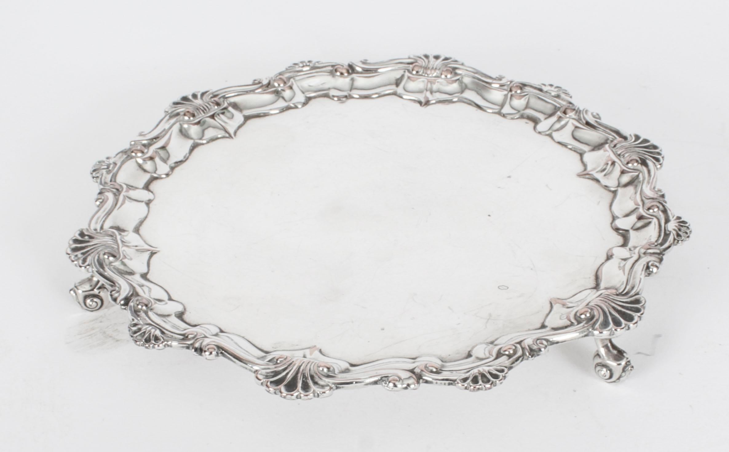 This is an exquisite English antique Old Sheffield Plate salver, circa 1780 in date.
 
The elegant  shaped circular salver features leafy scroll border with the field inlaid with a band of strapwork on tripod feet.
 
Add an elegant touch to your