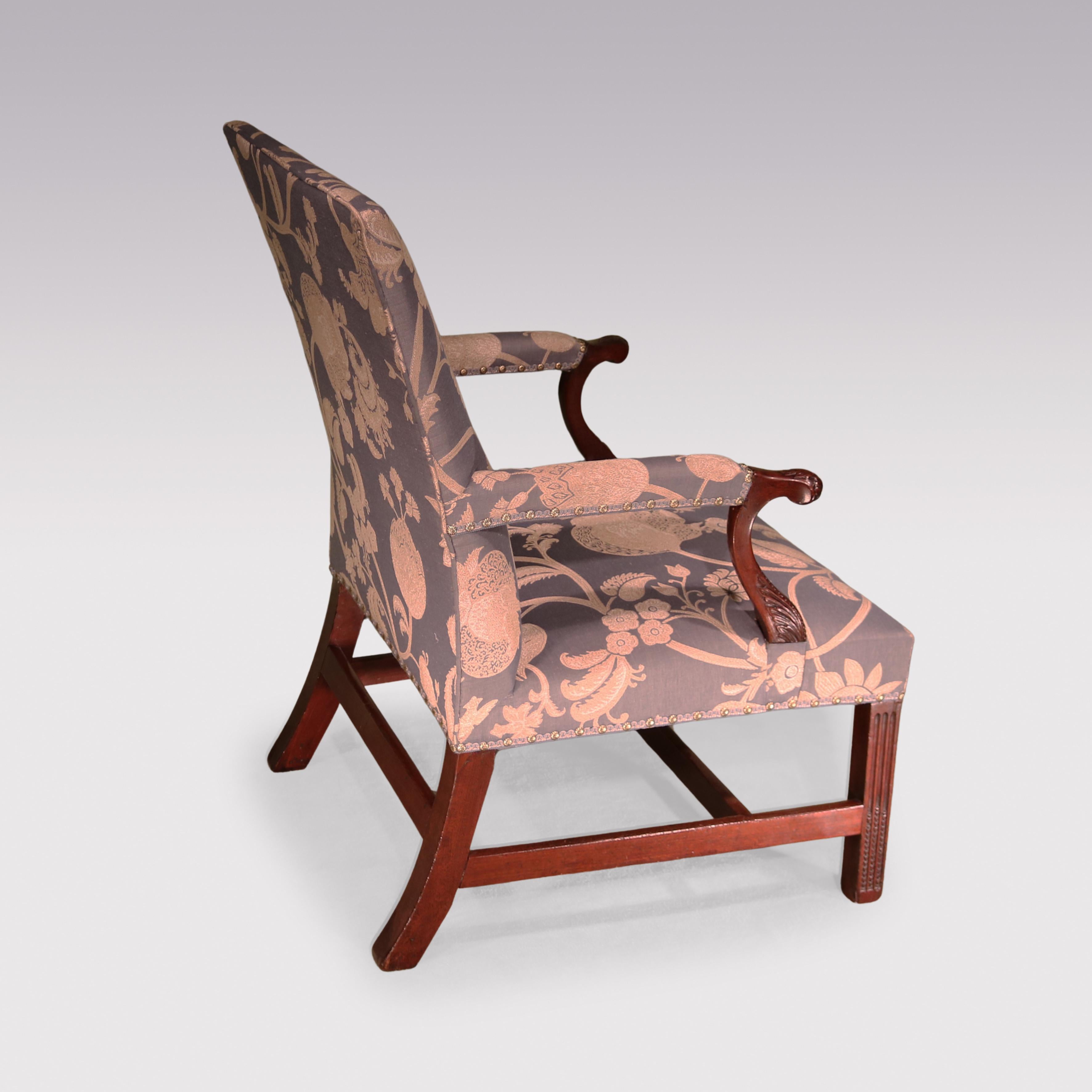 A Mid-18th Century Chippendale period mahogany Library Gainsborough Armchair having acanthus carved set-back arms supported on fluted legs with leaf carving to the lower sections.