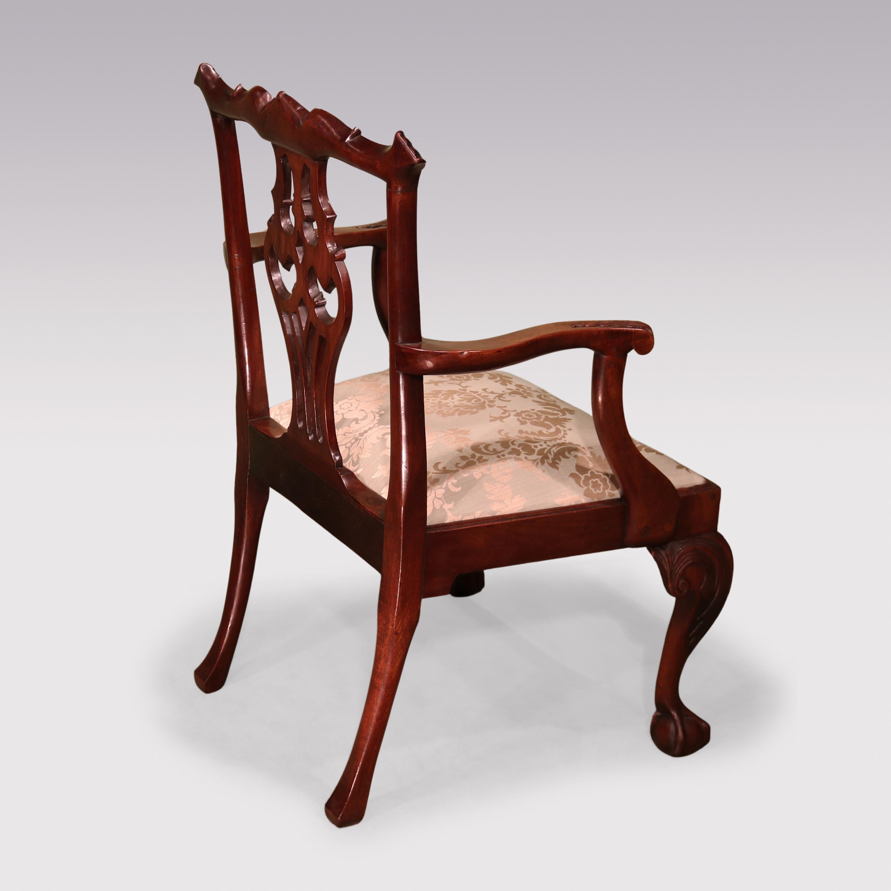 A Mid-18th Century Chippendale period mahogany Armchair having acanthus carved serpentine top-rail above interlaced splat. The Chair, with carved & fluted set-back arms & drop-in seat supported on carved cabriole legs ending on claw & ball feet.