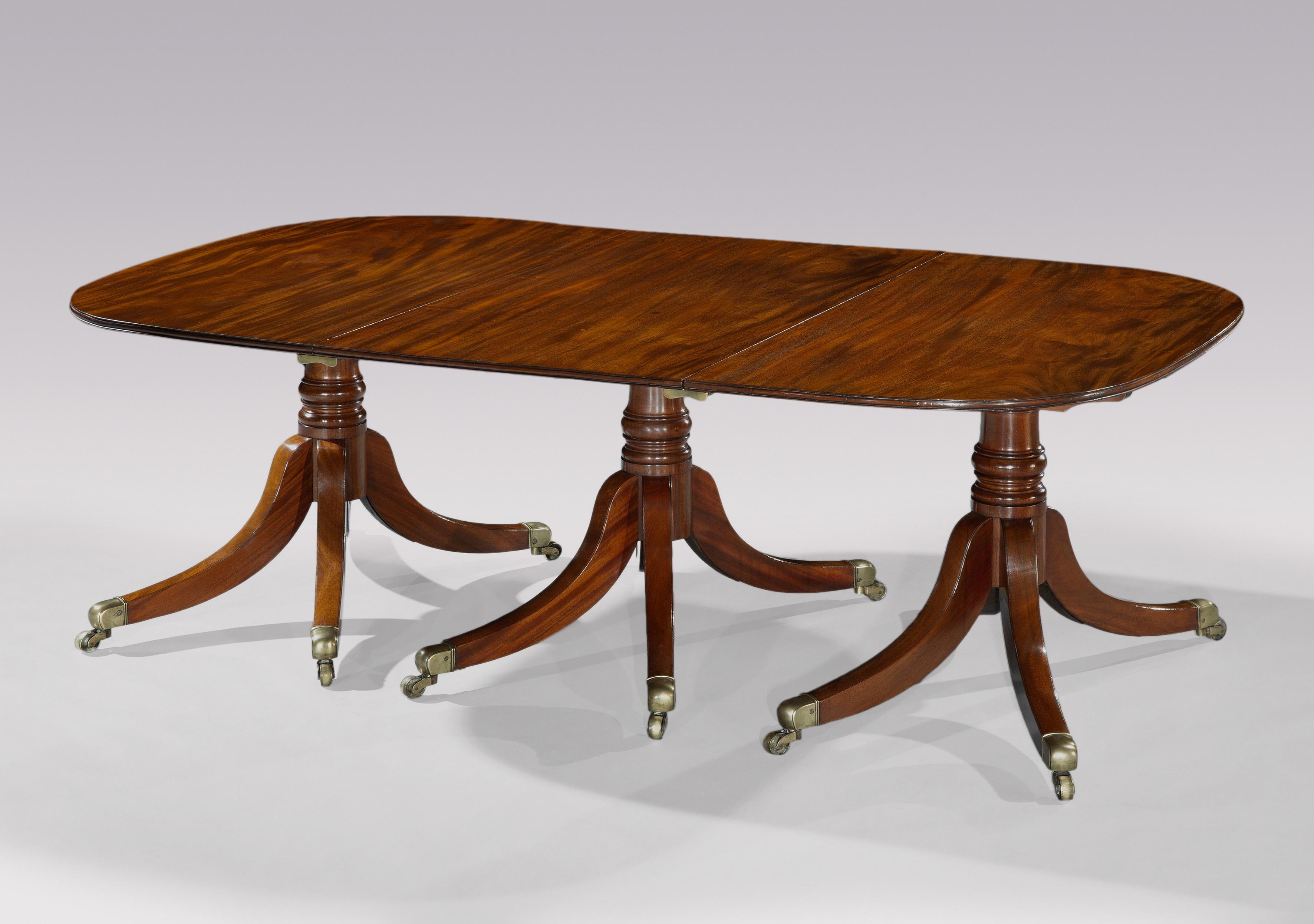 English Antique George III period figured mahogany three pillar dining table