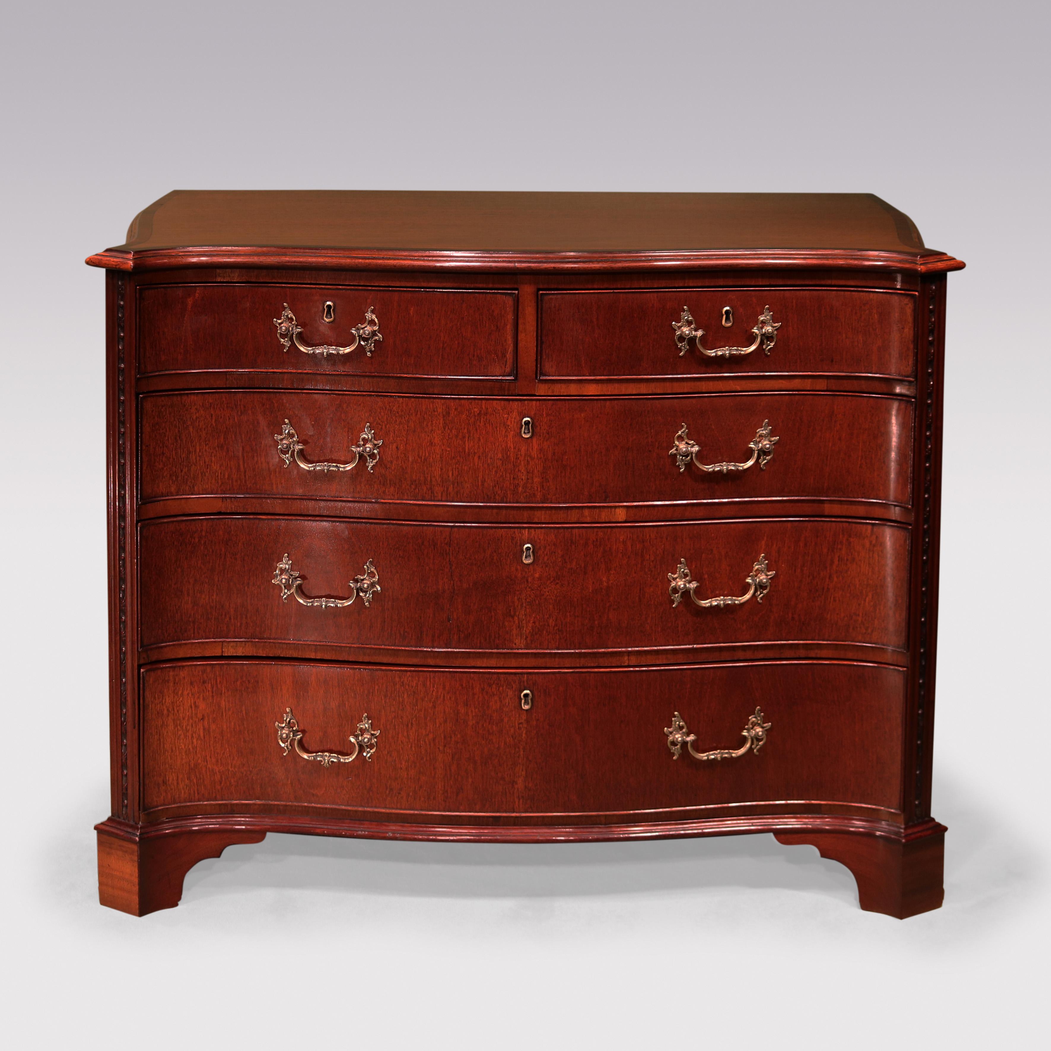 A mid-18th Century Chippendale period mahogany serpentine Chest, having moulded edged crossbanded canted cornered top above 2 short & 3 long cockbeaded drawers retaining original brass rococo handles, flanked by moulded & carved columns supported on