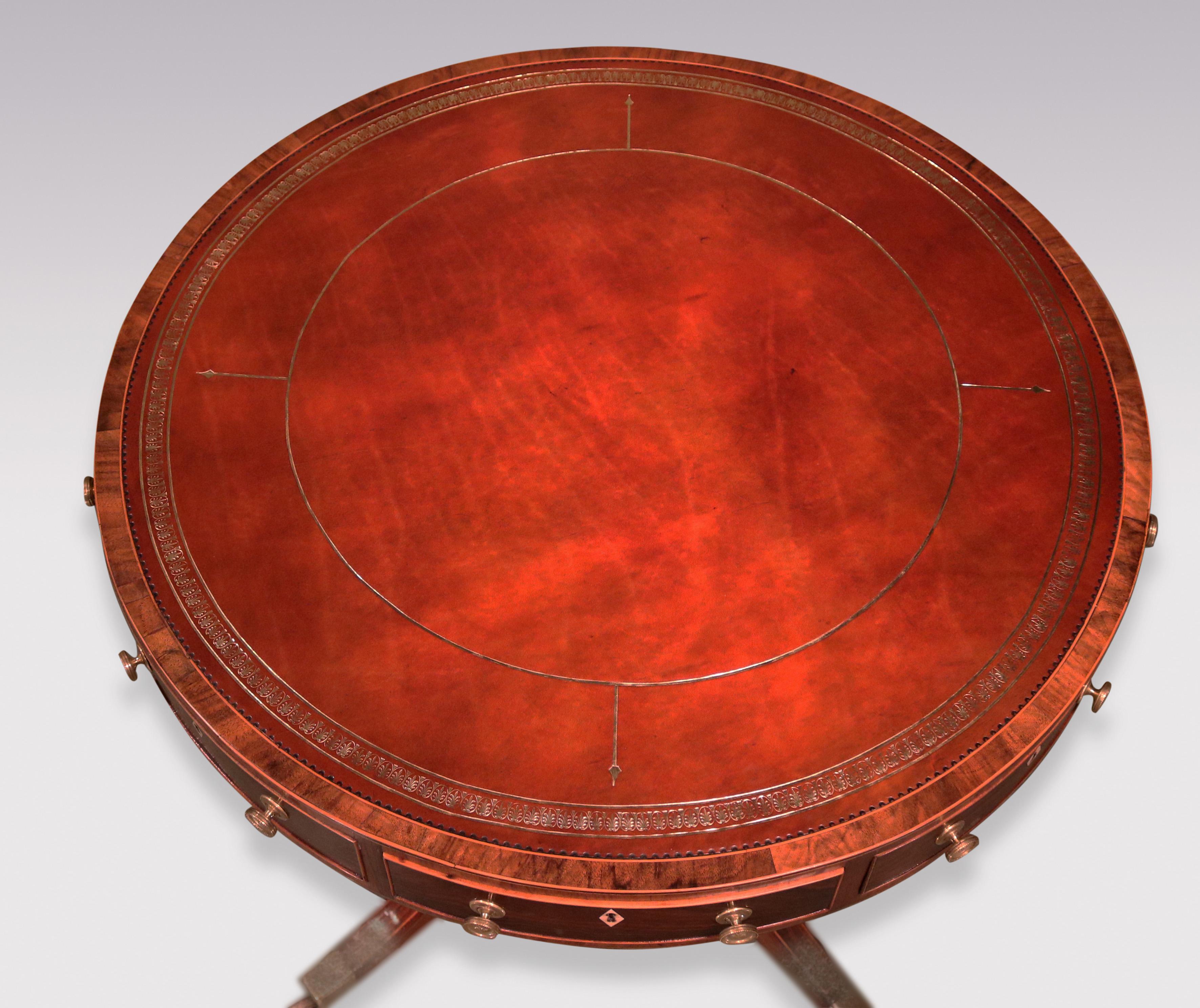 A fine George III period rosewood Drum Table of attractive small proportions, boxwood strung throughout, having circular faded red leather gilt tooled top, with tulipwood banded frieze fitted with 4 drawers & pen-drawer, on turned gunbarrel stem