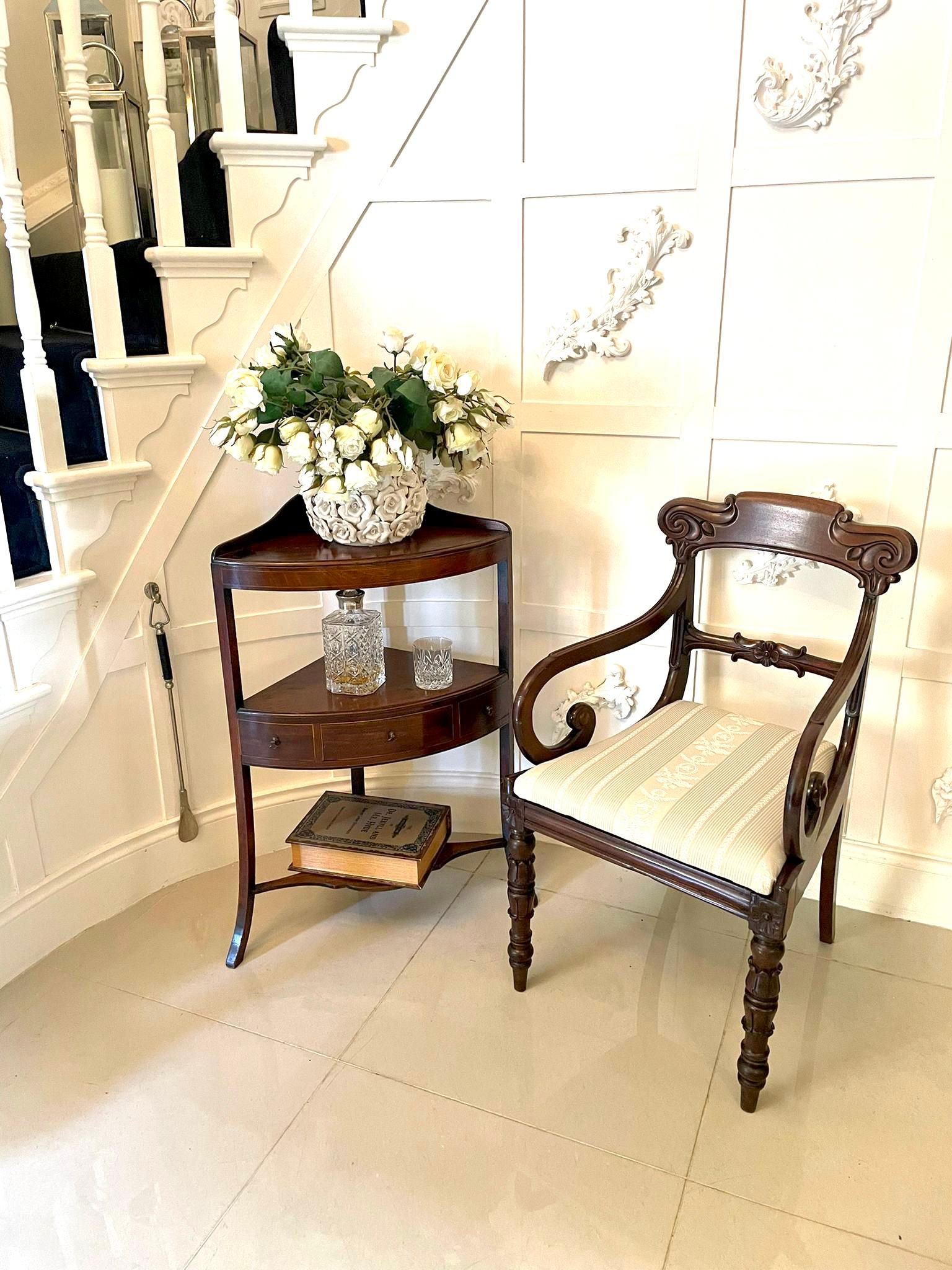 Antique George III quality mahogany bow fronted corner table having a shaped gallery back bow fronted mahogany top above a mahogany undertier with a central drawer and two dummy drawers with satinwood stringing and original brass handles standing on