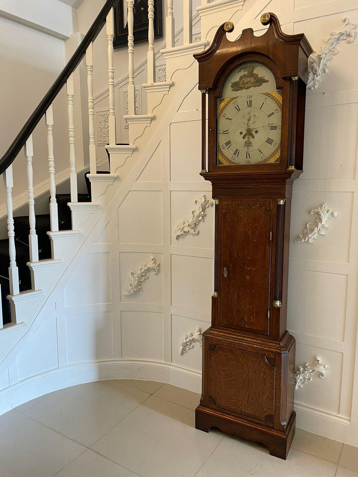 Antique George III quality 8 day oak longcase clock by Walker of Nantwich having a quality oak case crossbanded in mahogany, swan neck pediment, reeded columns to the hood, shaped door to the centre of the case flanked by reeded columns with brass