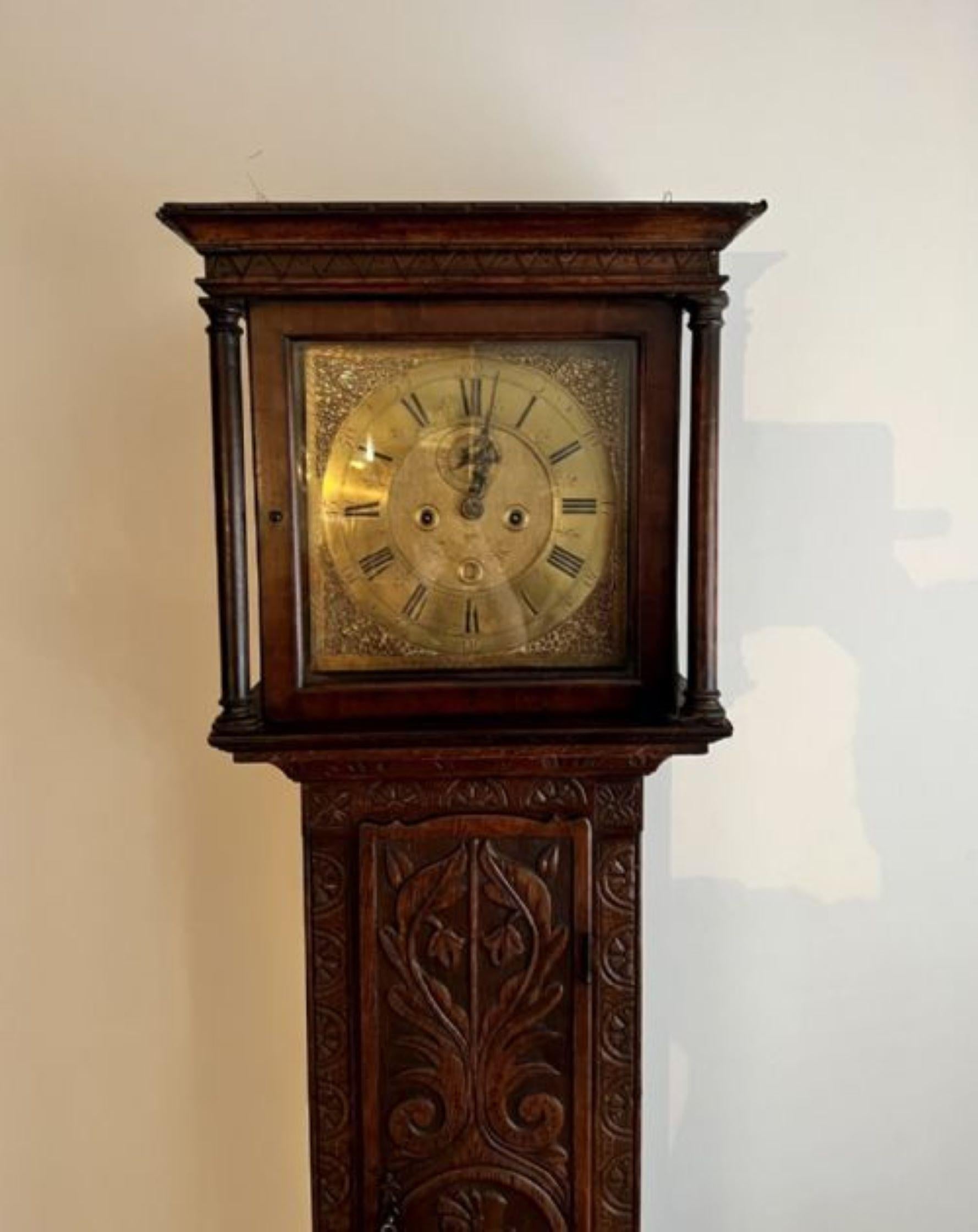 Antique George III quality carved oak brass face long case clock having a quality George III long case clock in a wonderful carved oak case with a square brass dial with original hands having an 8 day movement striking on the hour and half hour on a