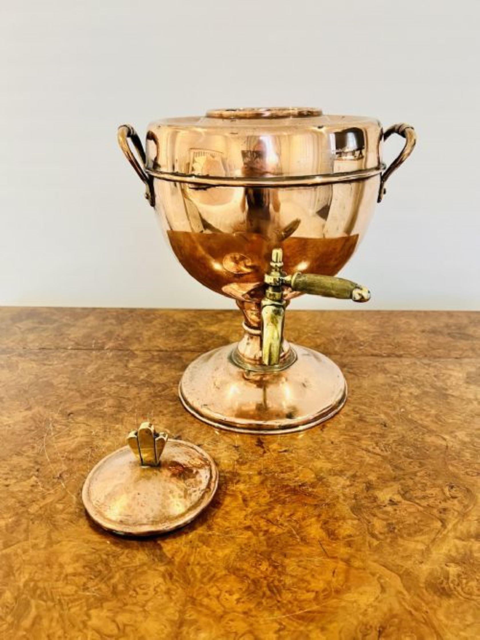 Antique George III quality copper & brass samovar having a quality copper samovar with a lift off lid and brass knob, shaped copper handles to the sides, with a brass tap standing on a circular base 