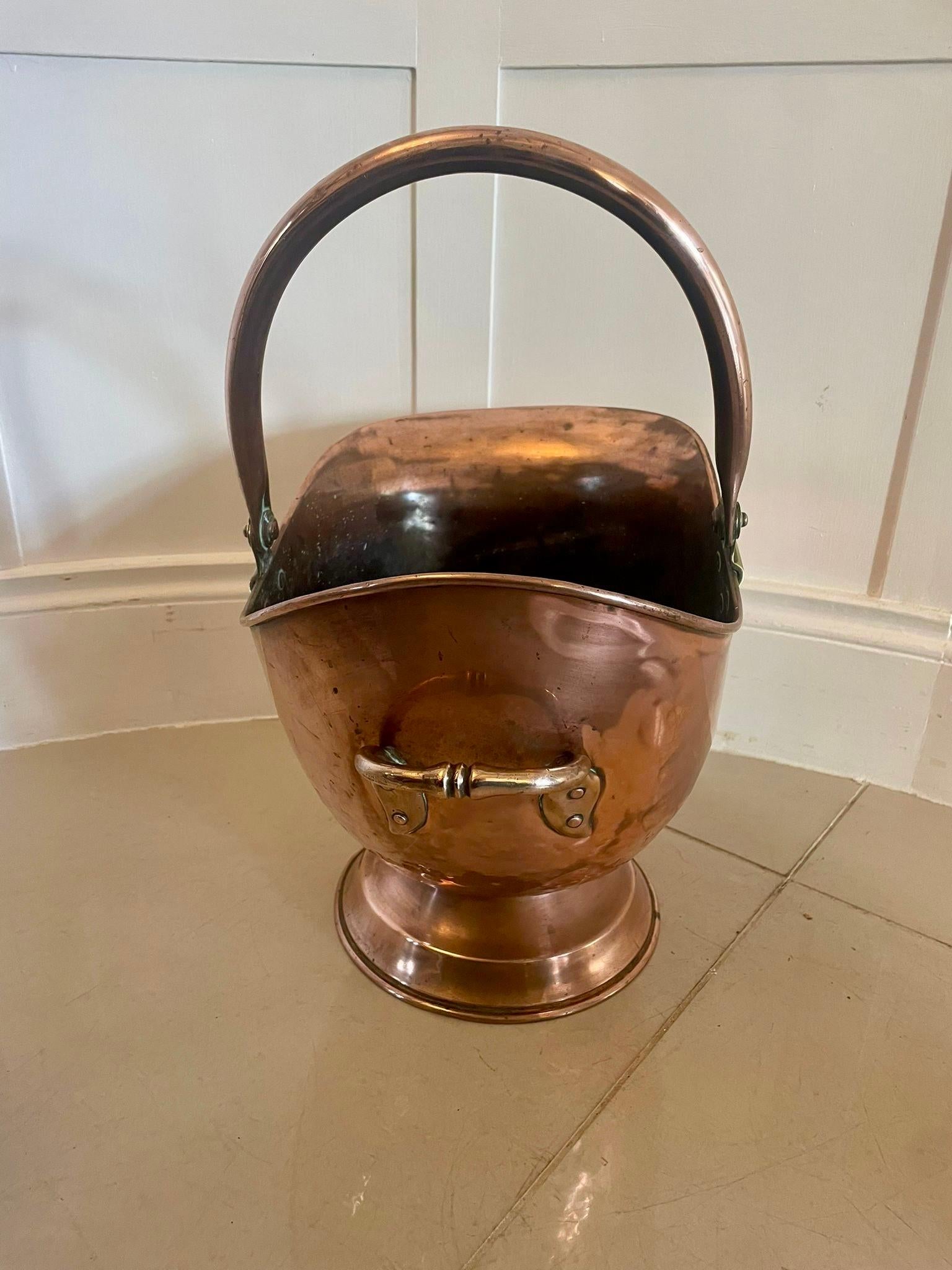Antique George III quality copper coal scuttle having a copper swing carrying handle with brass hinges above a lovely copper coal scuttle with a shaped top standing on a circular base


Dimensions:
Height 67 cm
Width 44 cm
Depth 27 cm


Dated 1820

