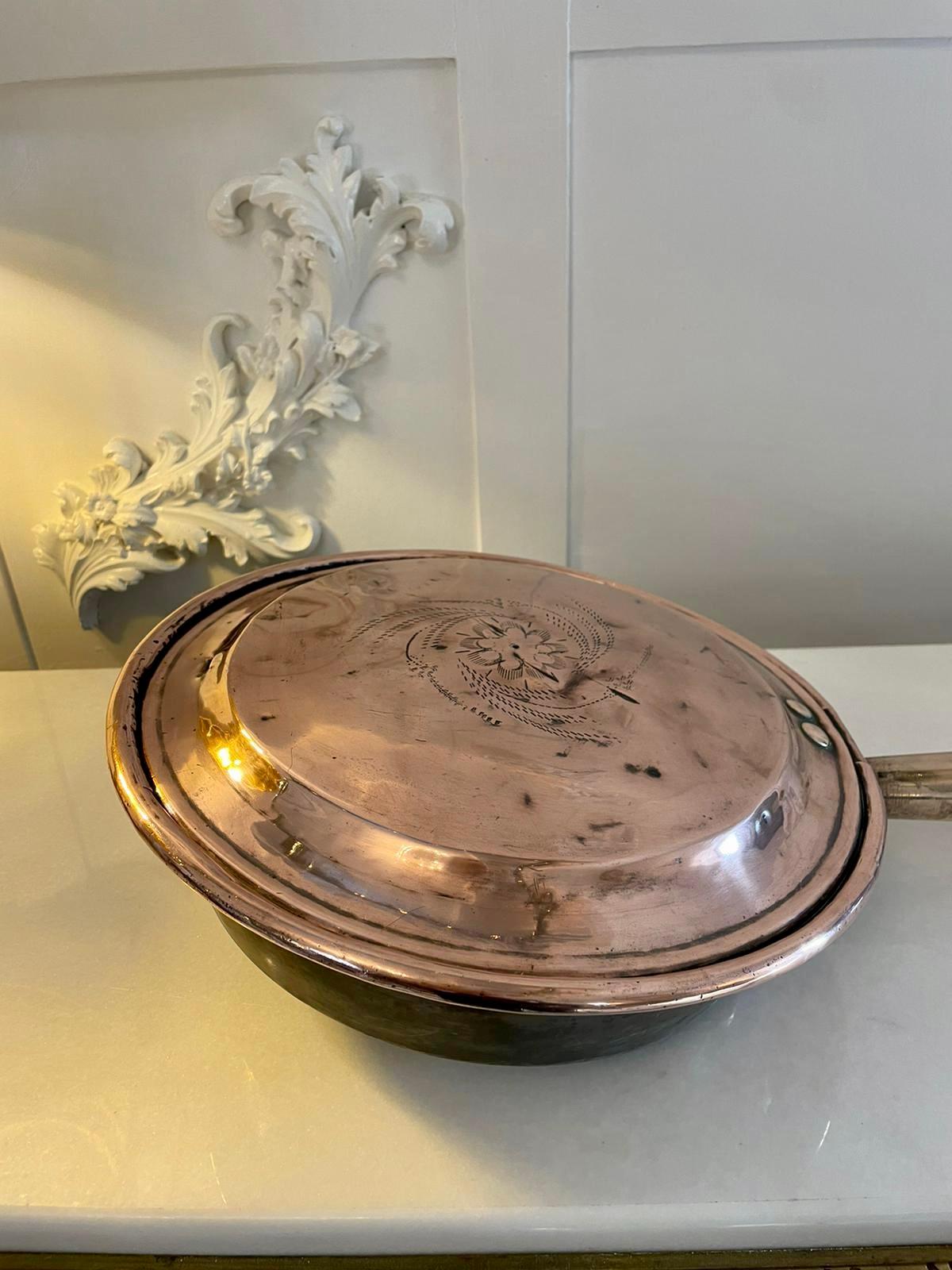 Antique George III quality copper warming pan having a quality original turned handle with a circular copper warming pan with an engraved lift up lid

H 108 x W 31 x D 7.5cm
Date 1800
