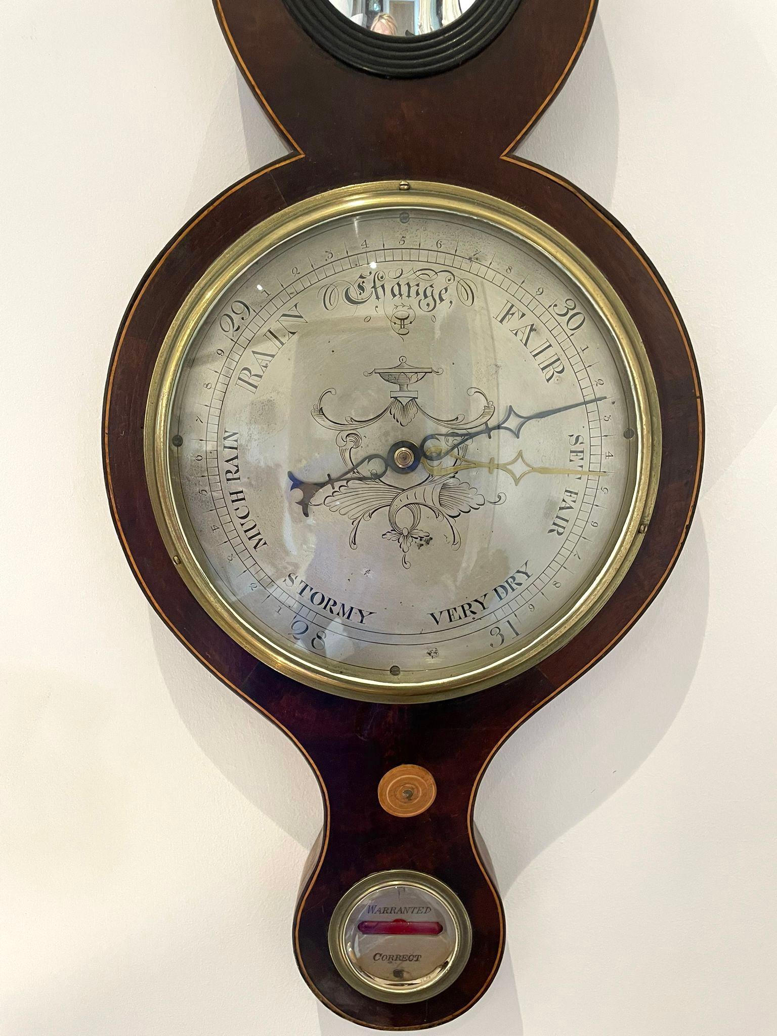 Antique George III quality mahogany banjo barometer having a quality mahogany shaped case with a swan neck pediment and satinwood stringing, circular silvered engraved dial with original hands and bezel, thermometer, fitted hygrometer, circular