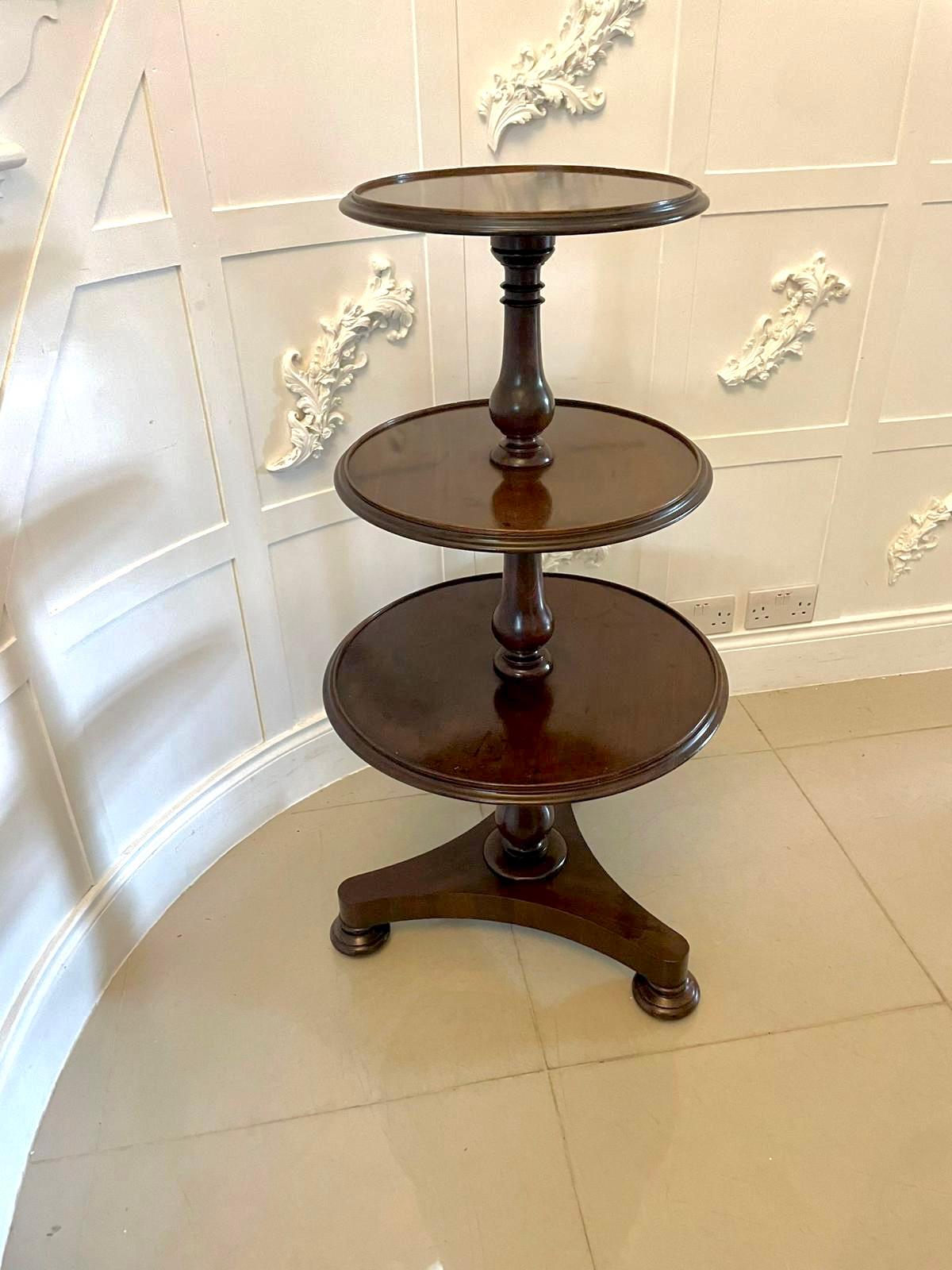 Antique George III quality mahogany circular dumbwaiter having three circular shelves with a moulded edge supported by turned shaped columns standing on a platform base with original turned feet and castors


A classic quality example of the period