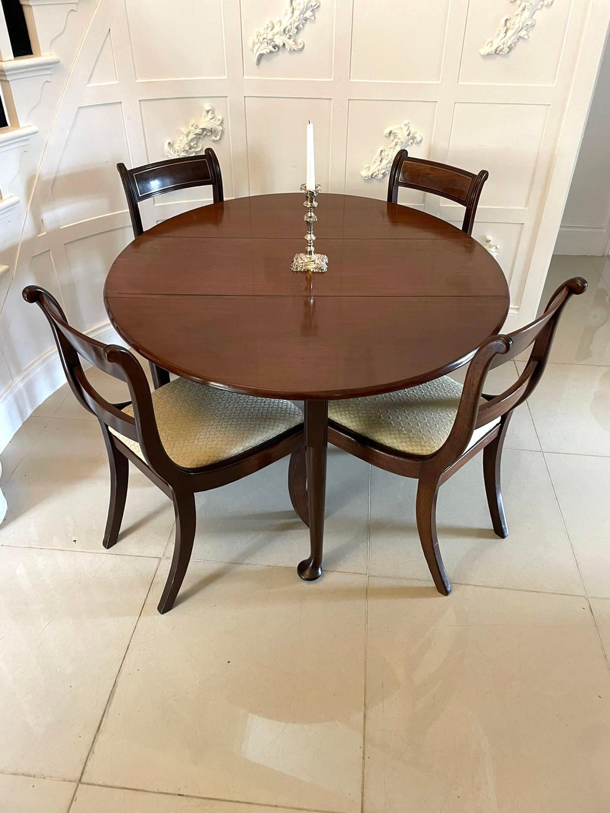 Antique George III quality mahogany dining/centre table having a quality mahogany top with two drop leaves, swing out gateleg action for support standing on turned tapering legs with pad feet

A handsome all original 18th century example boasting