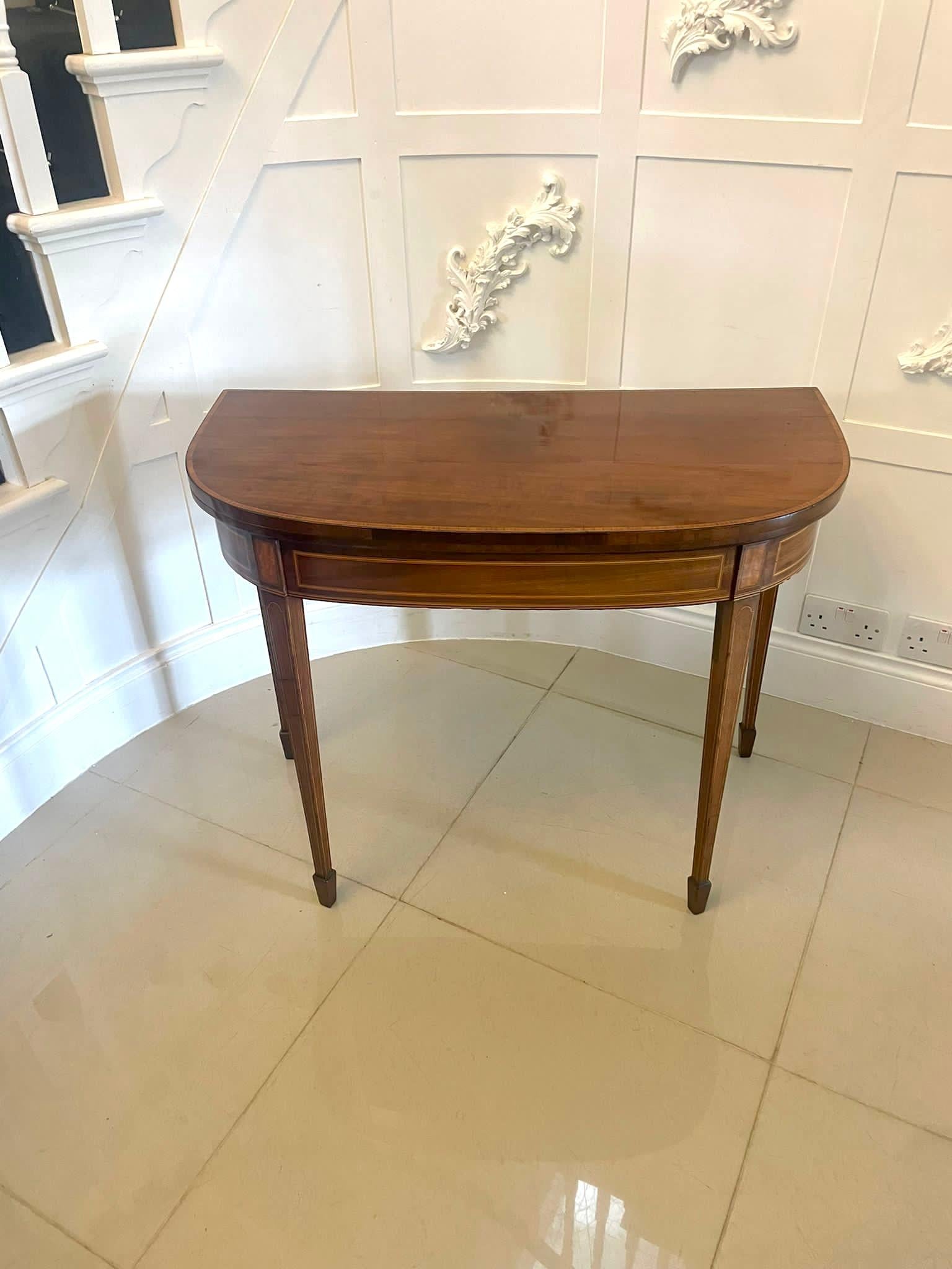 Antique George III quality mahogany inlaid satinwood card/side table having a quality mahogany satinwood crossbanded fold over top opening to reveal the original baize interior with satinwood crossbanding, shaped mahogany frieze with satinwood inlay