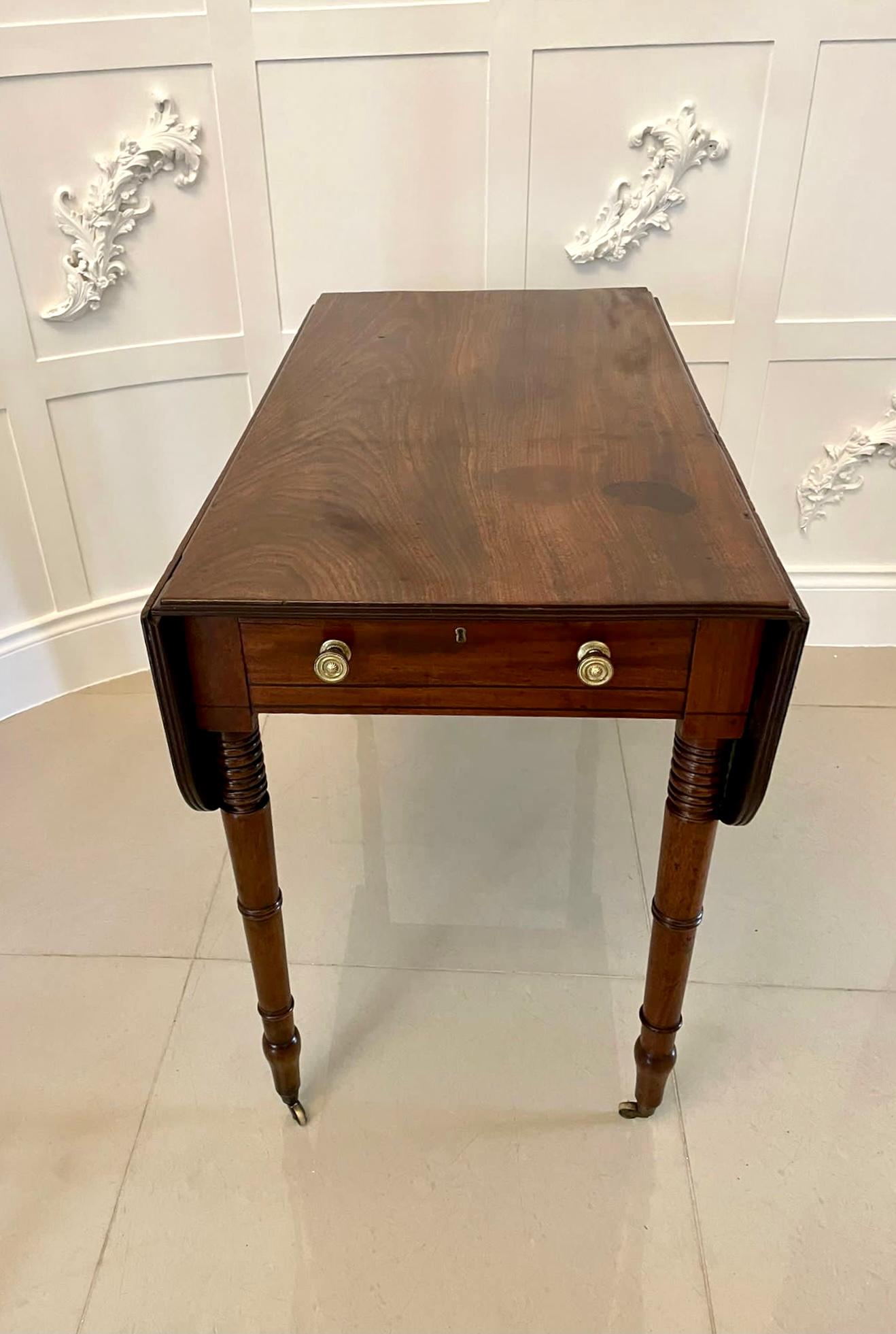 Antique George IIIl quality mahogany Pembroke table having a quality mahogany top with two drop leaves and a reeded edge, one long drawer standing on four elegant mahogany turned tapering legs with original castors 

In original untouched