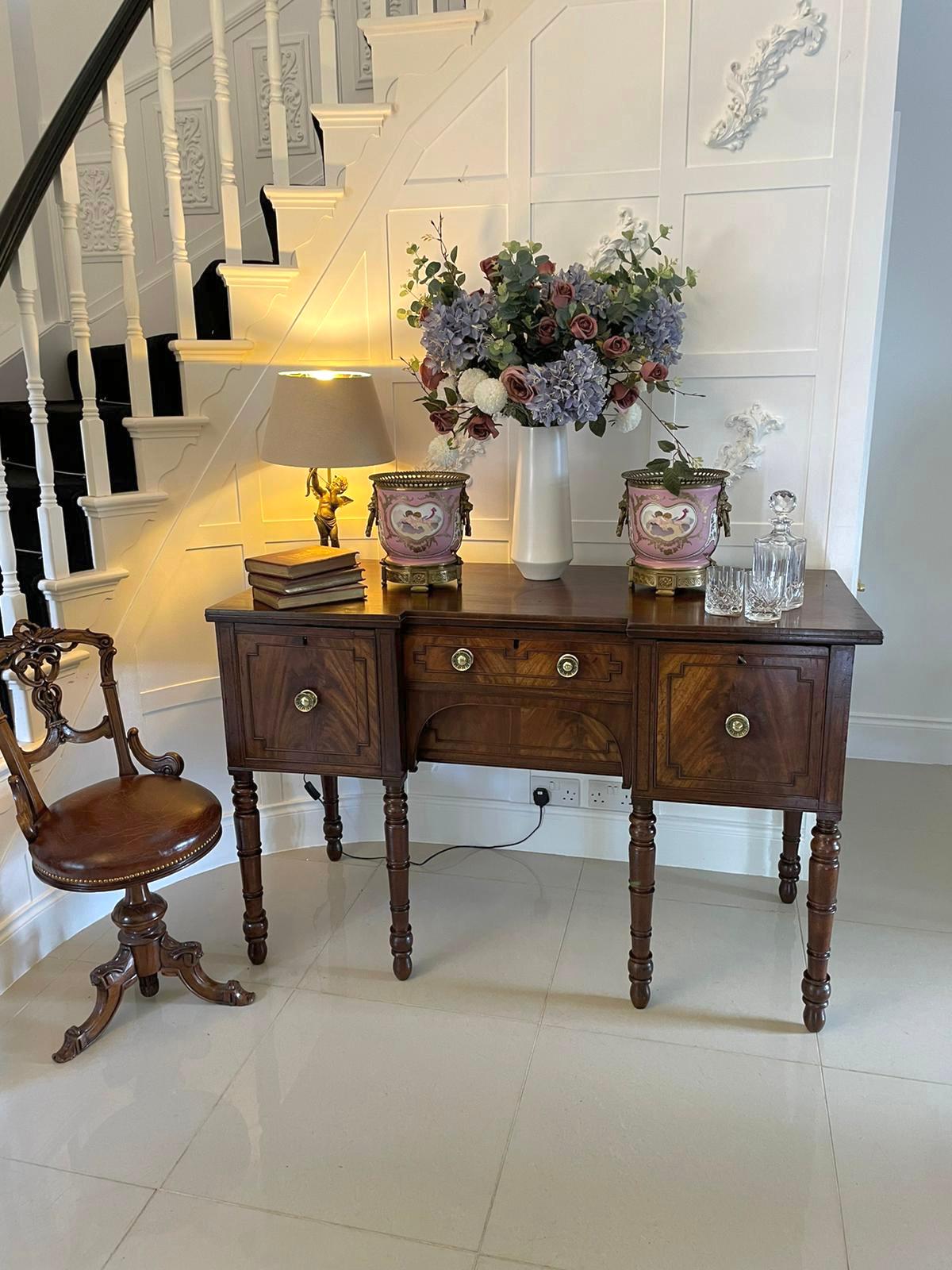 Antique George III quality mahogany sideboard having a quality mahogany top above a centre drawer flanked by a drawer and a drop down dummy drawer all in figured mahogany with moulding and pretty original brass handles and boasting a figured