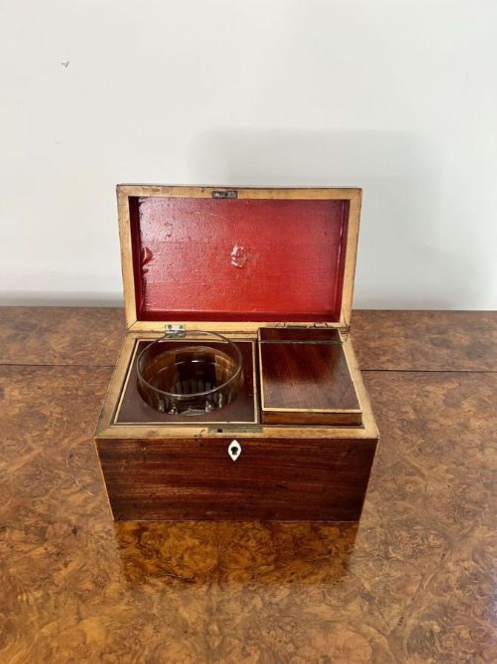 Antique George III quality mahogany tea caddy having a quality antique George III mahogany and satinwood inlaid stringing tea caddy with a lift up lid opening to reveal the original fitted interior, with the original handle to the top of the caddy.