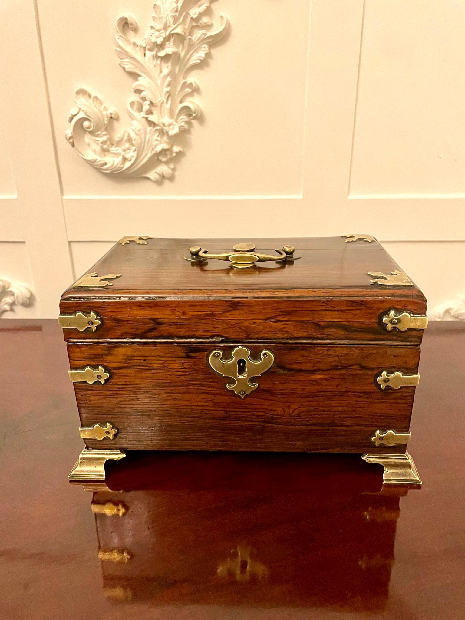 Antique George III quality rosewood and brass tea caddy having a quality George III rosewood tea caddy with original brass mounts, handle and key opening to reveal three original tea caddies

A charming original example

H 14.5 x W 25 x D 16cm 
Date