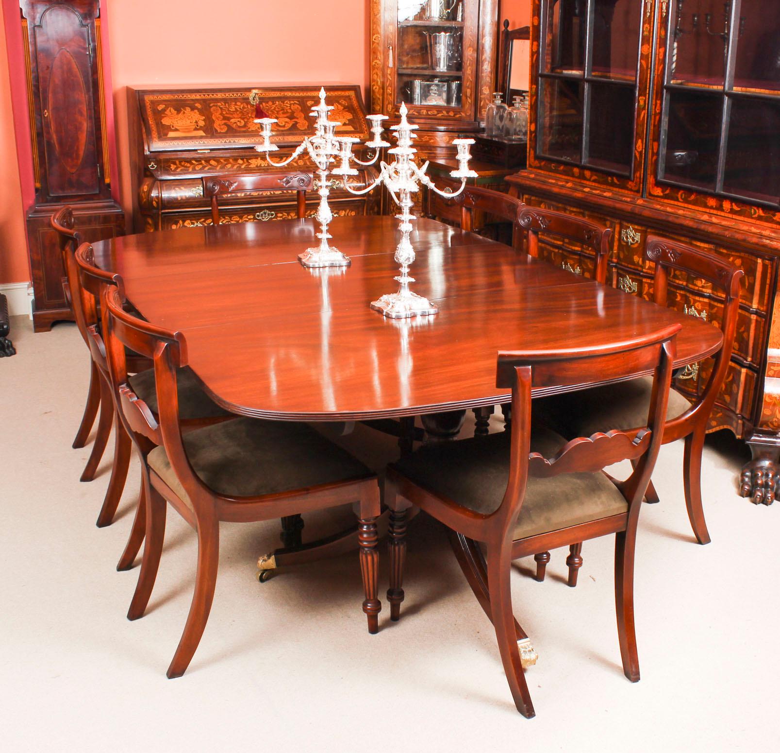 This is an elegant dining set comprising an antique George III Regency Period dining table, circa 1820 in date, with a fabulous set of eight bespoke Regency style dining chairs.

The table has one additional leaf and is raised on twin 