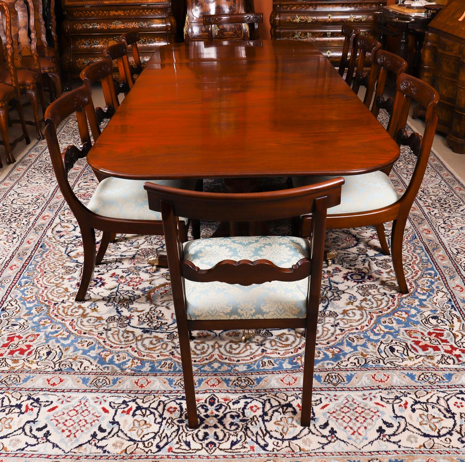 This is an elegant dining set comprising an antique George III Regency Period dining table, Circa 1820 in date, with a fabulous set of ten Barback dining chairs.

The table has two additional leaves and is raised on twin 