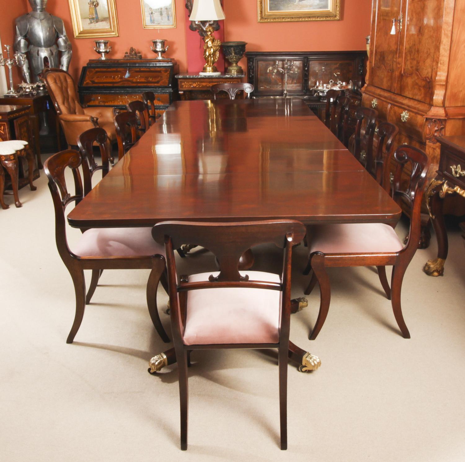 This is an elegant dining set comprising an antique George III Regency Period dining table with a fabulous set of twelve antique Regency dining chairs, all Circa 1820 in date.

The elegant antique George III Regency triple pedestal dining table