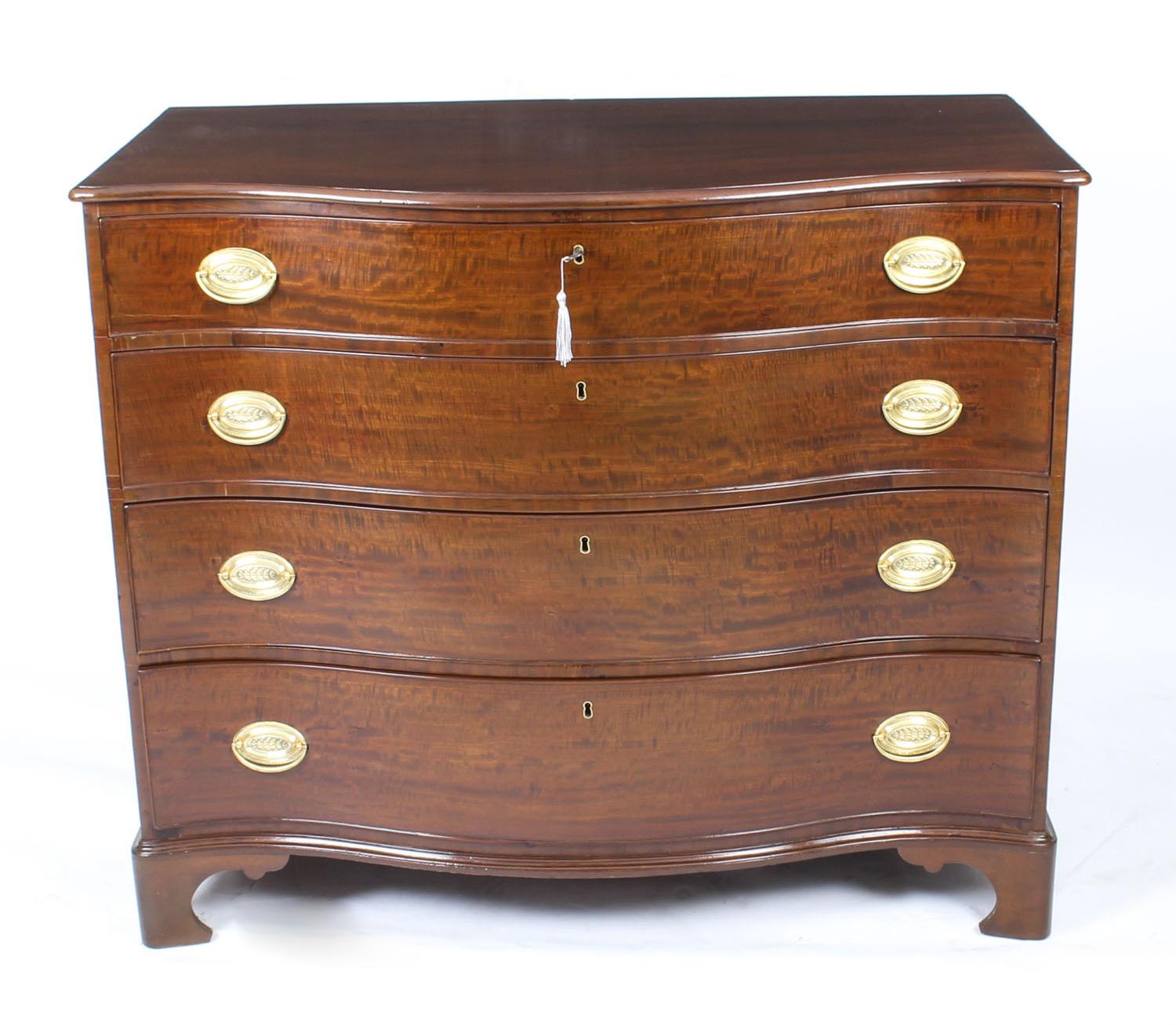 This is beautifully crafted antique George III flame mahogany serpentine fronted chest of drawers, circa 1780 in date.
 
The curvaceous serpentine chest is made from the finest quality flame mahogany. The top features a moulded edge, it has four
