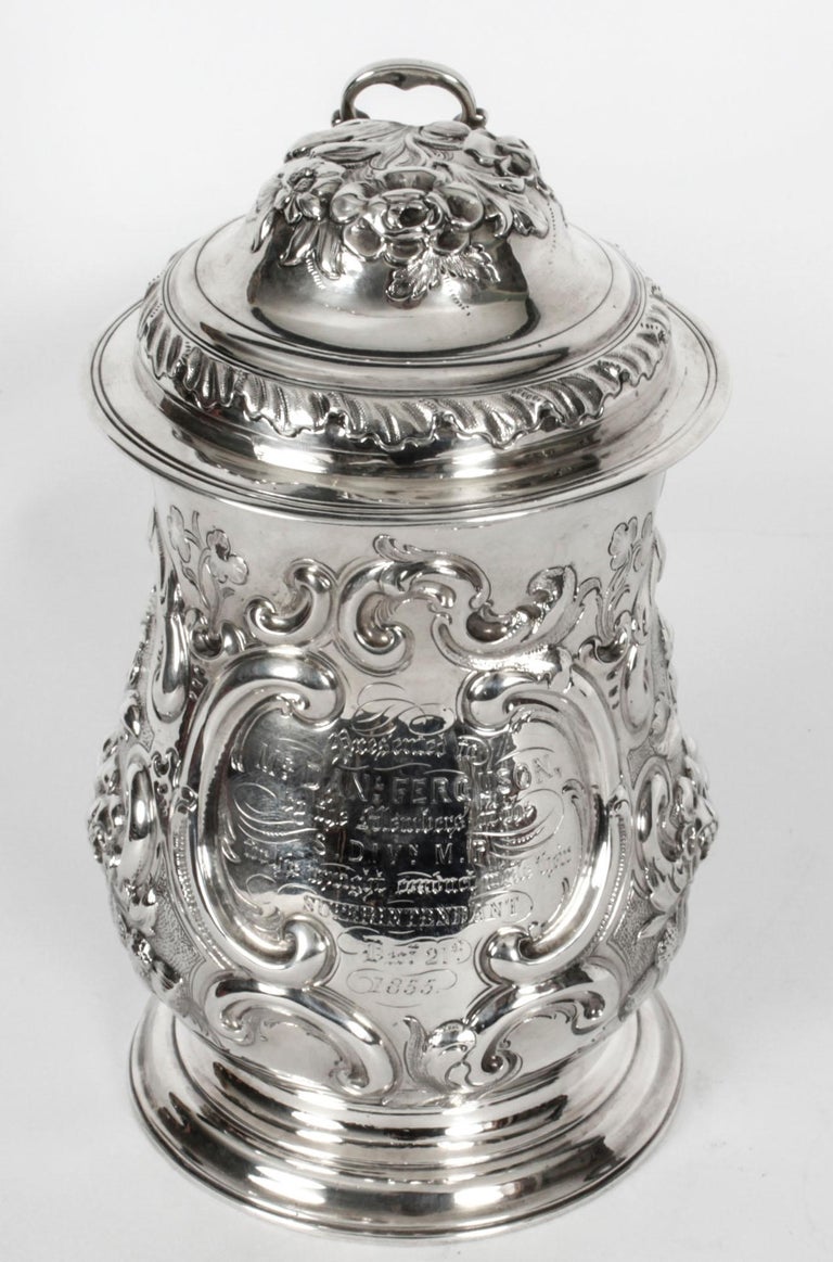 This is a truly wonderful antique English George III sterling silver lidded tankard with hallmarks for London 1763 and the maker's mark of the renowned silversmith, John Swift.
 
This superb tankard features wonderful embossed floral decorations