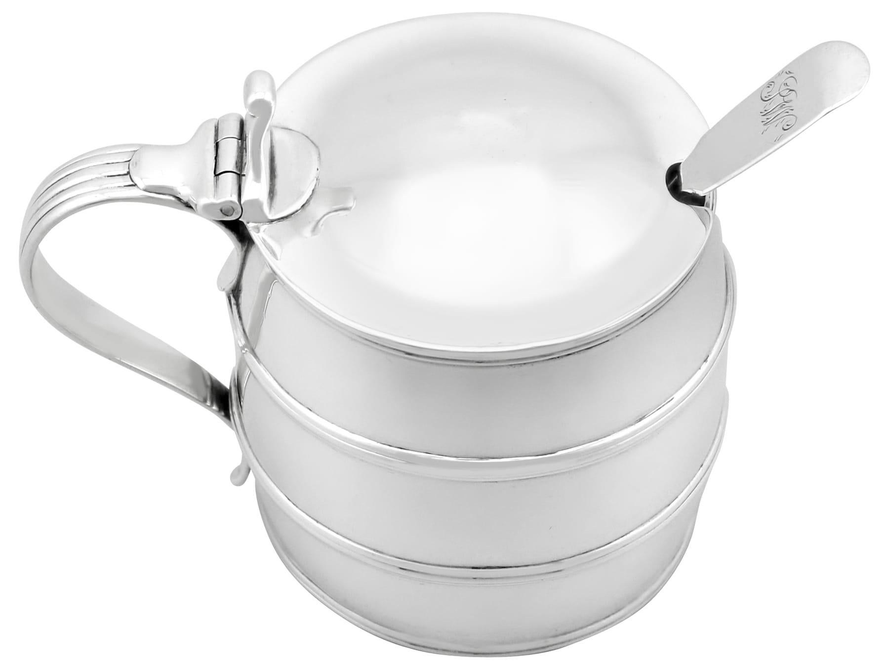A exceptional antique 18th century English sterling silver barrel shaped mustard pot; an addition to our Georgian silver cruets / condiments collection.

This exceptional antique George III sterling silver mustard pot has been realistically modelled