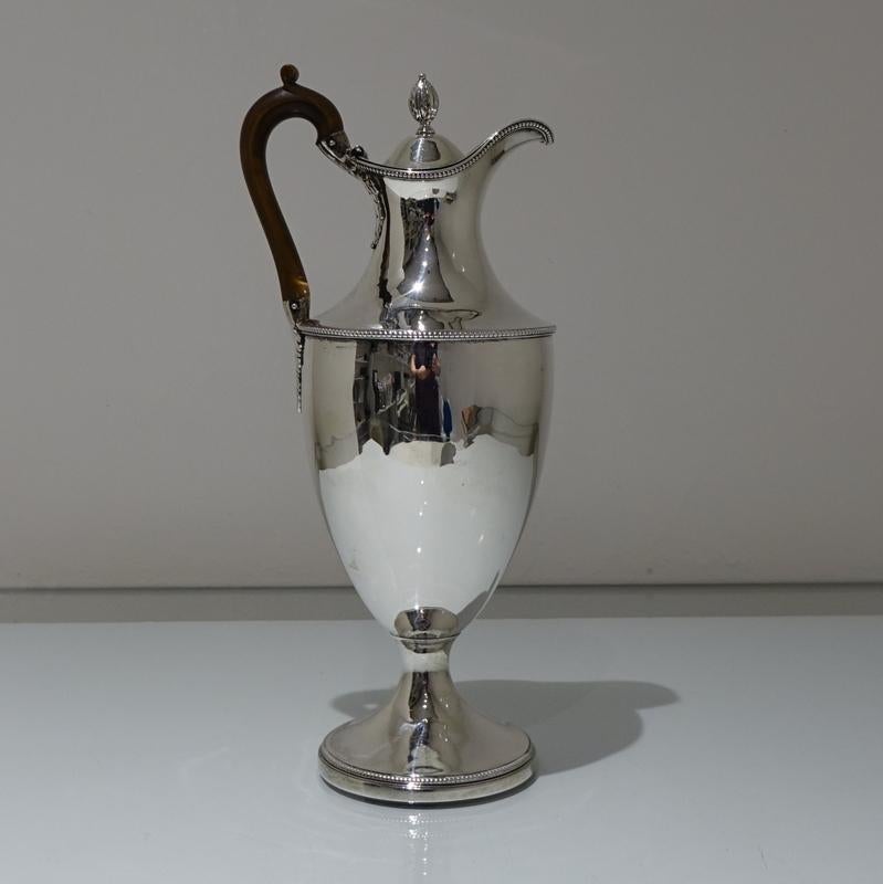 A beautiful 18th century large silver coffee jug plain formed in design with applied bead borders for highlights. The hinged lid is crowned with a stylish thumb piece and the centre front has a contemporary armorial for importance.

 

Weight