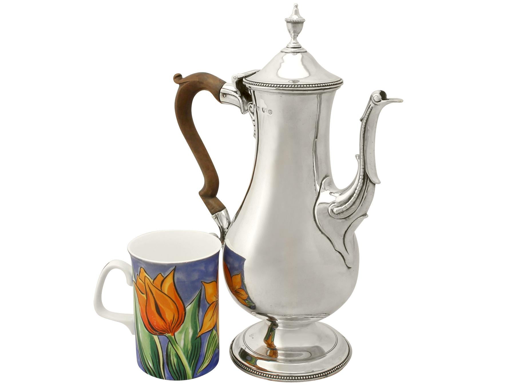 An exceptional, large and impressive antique Georgian English sterling silver coffee pot by Hester Bateman an addition to our silver teaware collection

This exceptional antique George III sterling silver coffee pot has a plain baluster shaped
