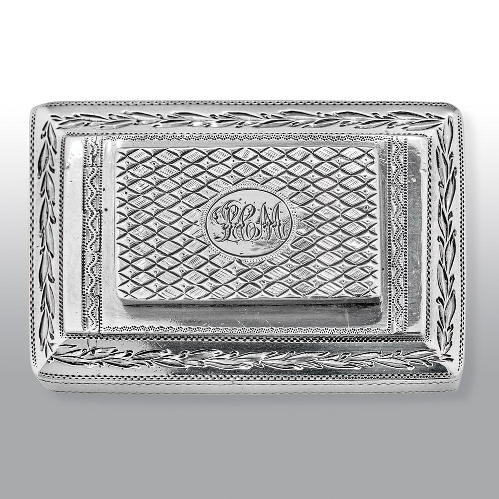 An extremely rare and fine George III sterling silver combination gilt-lined snuff box and vinaigrette, the rectangular snuff box decorated with bright-cut decoration, the vinaigrette housed in the hinged lid and engraved with a diaper effect